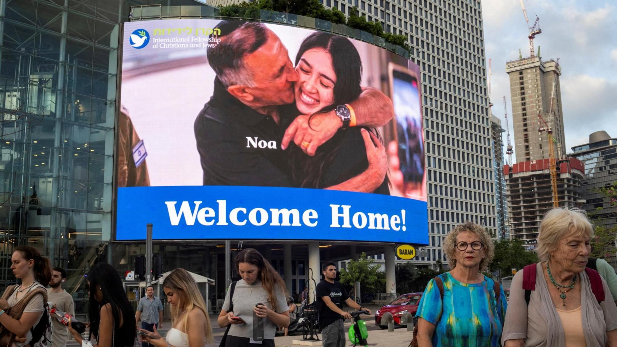 A giant screen displays a picture of rescued Israeli hostage Noa Argamani, in Tel Aviv, Israel (10 June 2024)