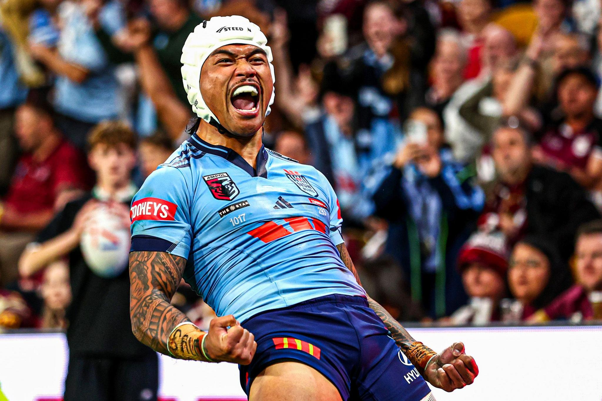 New South Wales Blues' Brian To'o celebrates after scoring a try during game one of the Men's State of Origin series against Queensland Maroons in Brisbane, Australia. Photo by Chris Hyde