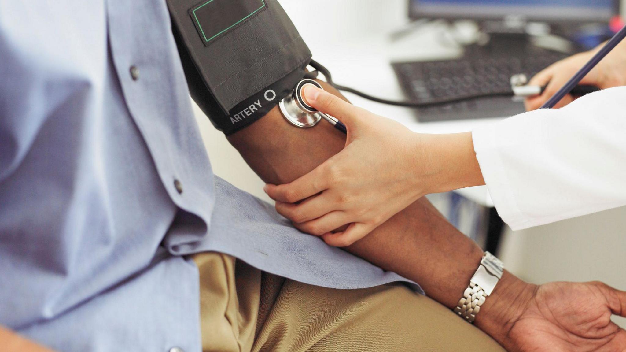 Picture of somebody having their blood pressure taken