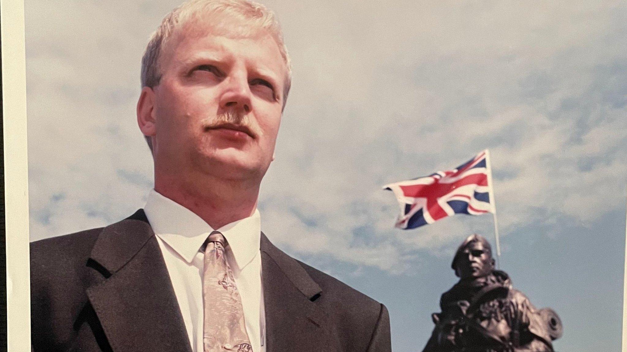 Peter Robinson beside the statue of the Yomper