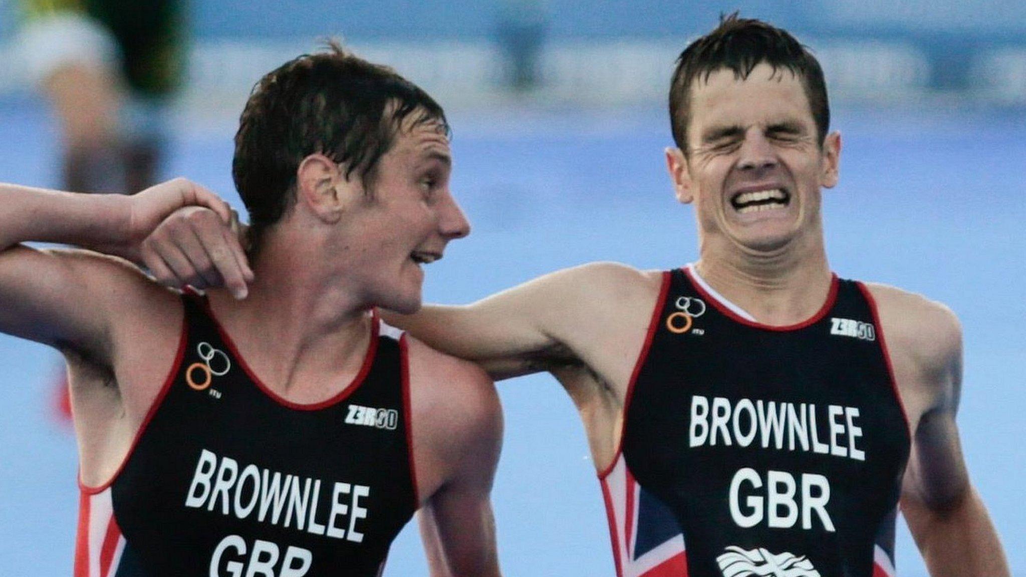 Jonny Brownlee is helped over the finish line by brother Alistair