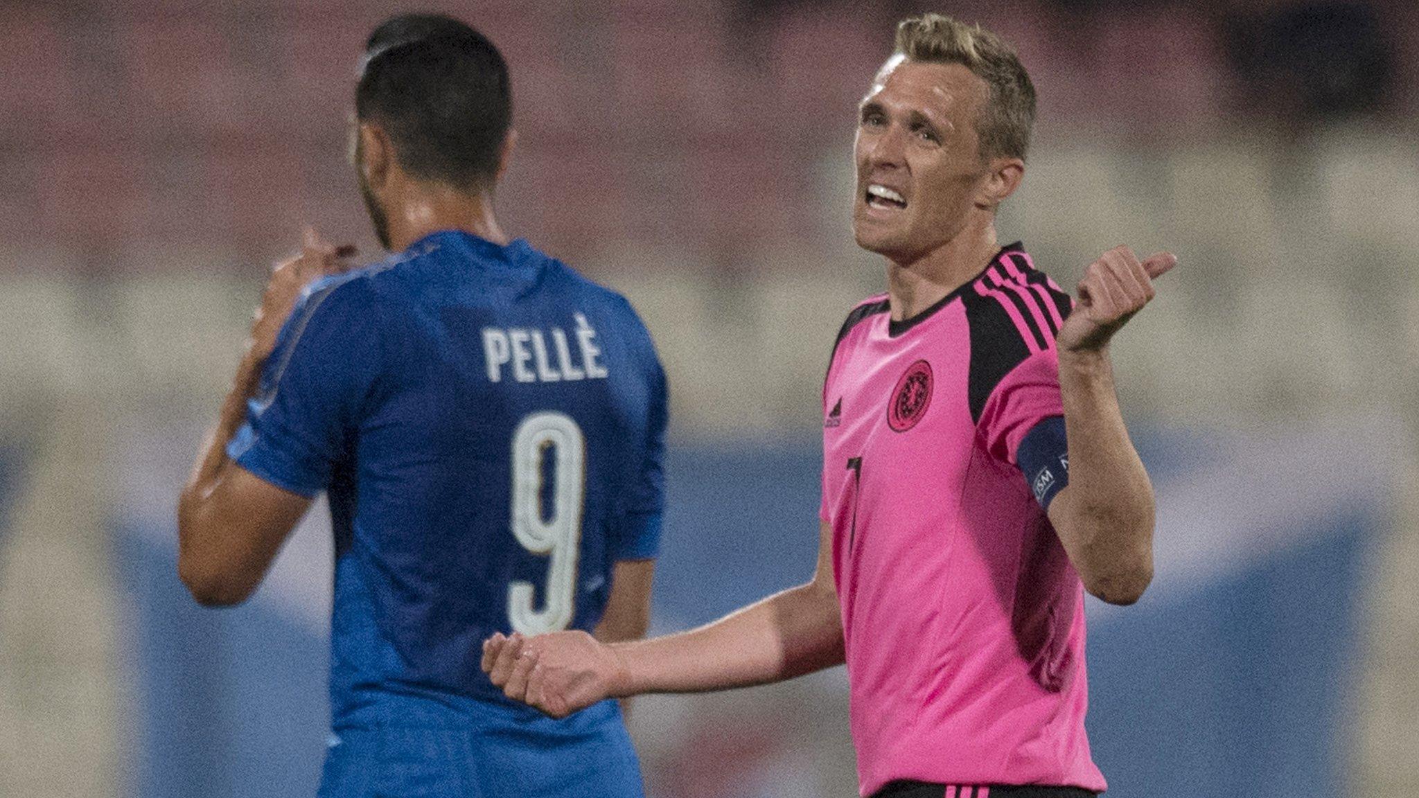 Scotland captain Darren Fletcher gestures to his players during their defeat by Italy