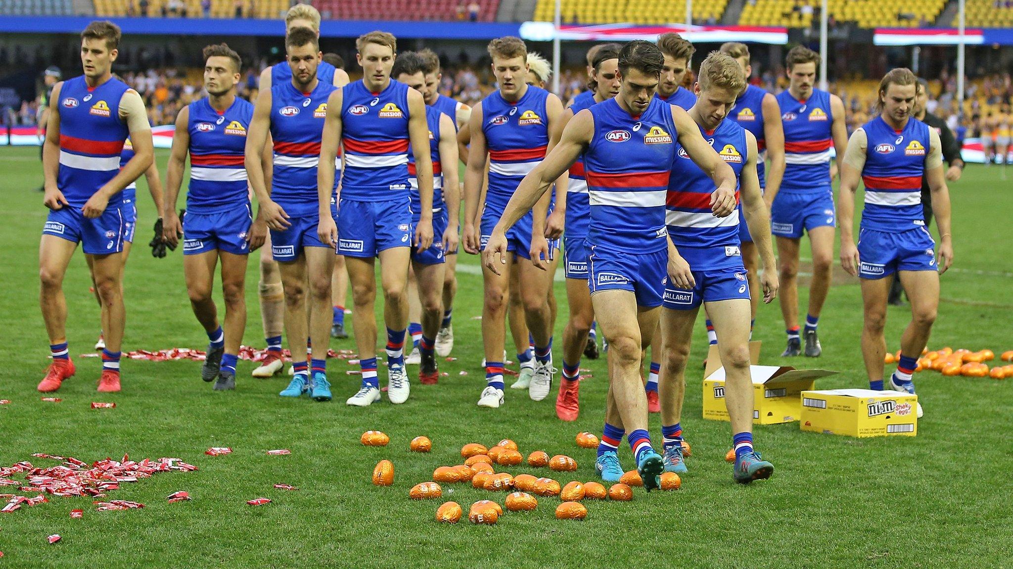 The Bulldogs leave the field through Easter eggs on the ground after losing the round two AFL match between the Western Bulldogs and the West Coast Eagles at Etihad Stadium on April 1, 2018 in Melbourne, Australia