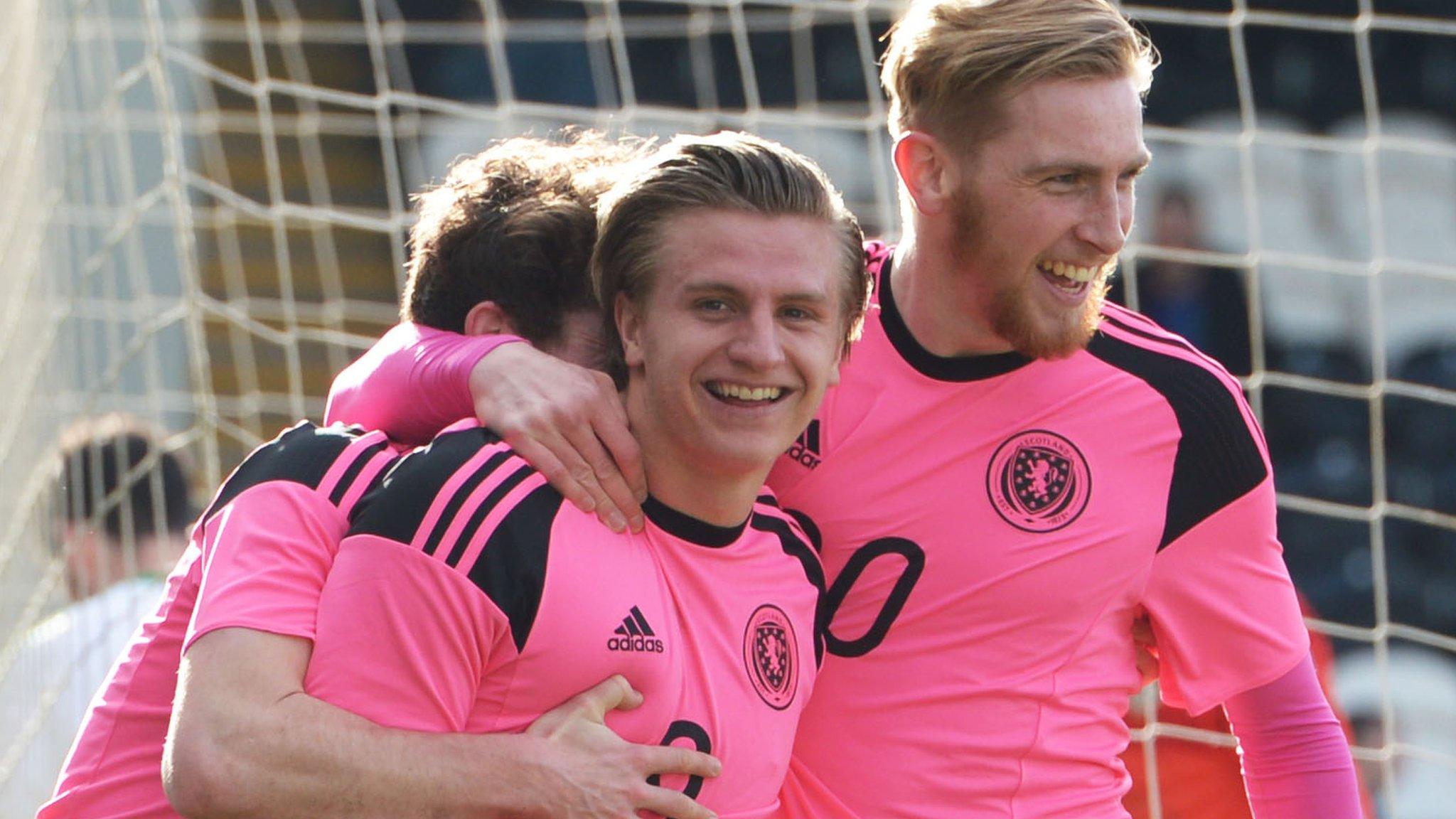 Scotland's Jason Cummings and Oliver McBurnie celebrate