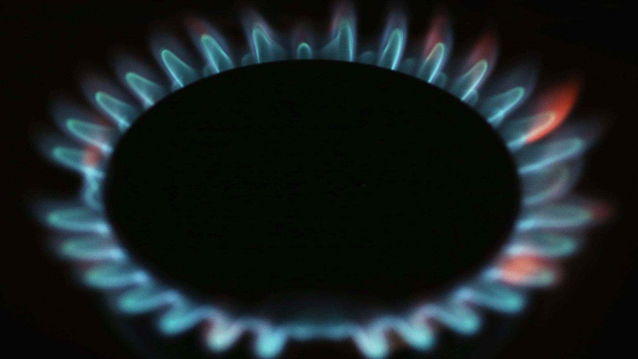 Close up of the blue flames of a gas hob