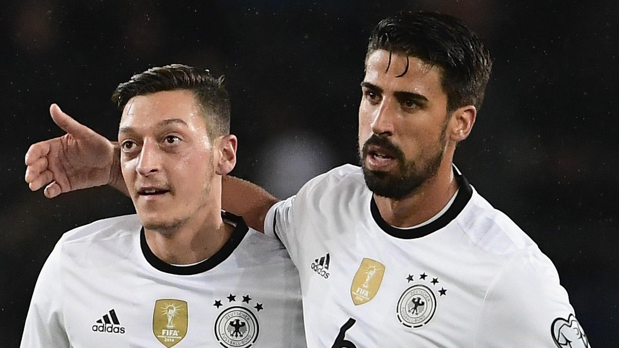 Mesut Ozil and Sami Khedira of Germany