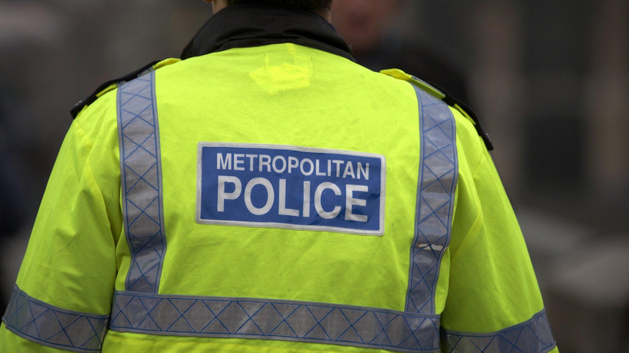 The back of a Metropolitan Police officer