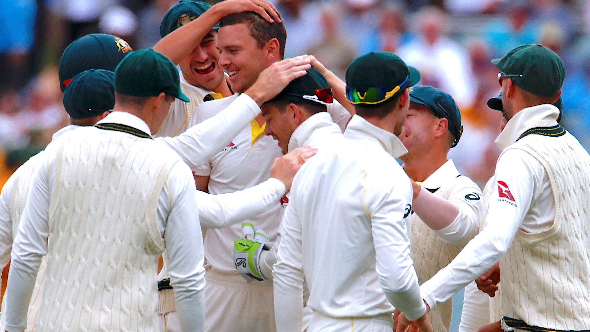 Australia players celebrate taking the wicket of England captain Joe Root during the second Test at Adelaide