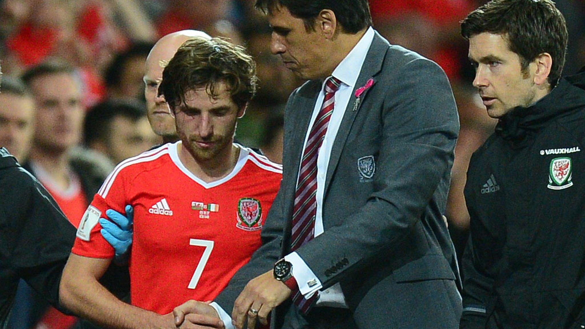 Joe Allen is congratulated by former Wales manager Chris Coleman