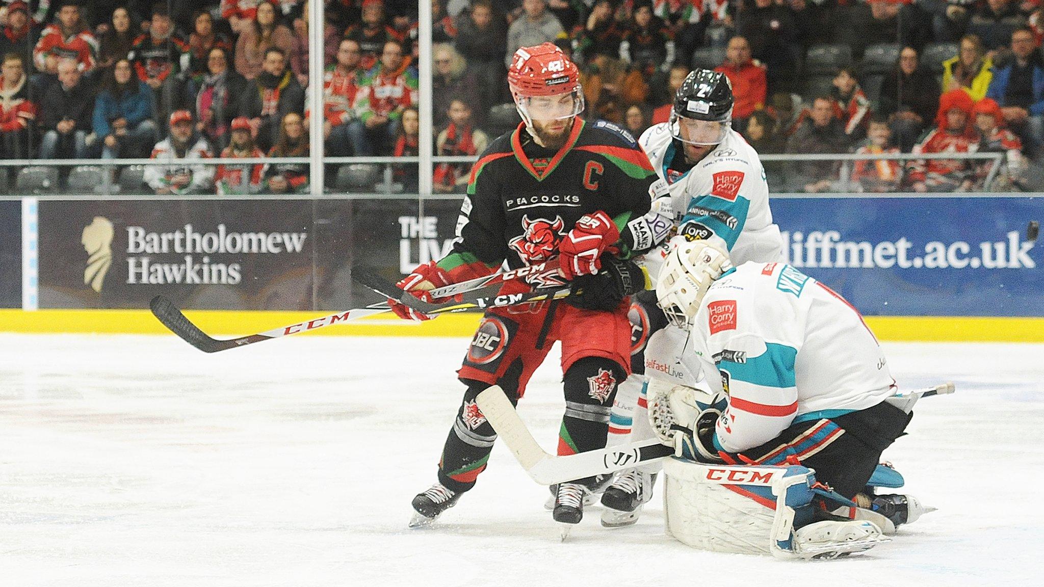 Belfast Giants stopper Jackson Whistle saves a Jake Morissette effort in Challenge Cup final against Cardiff Devils