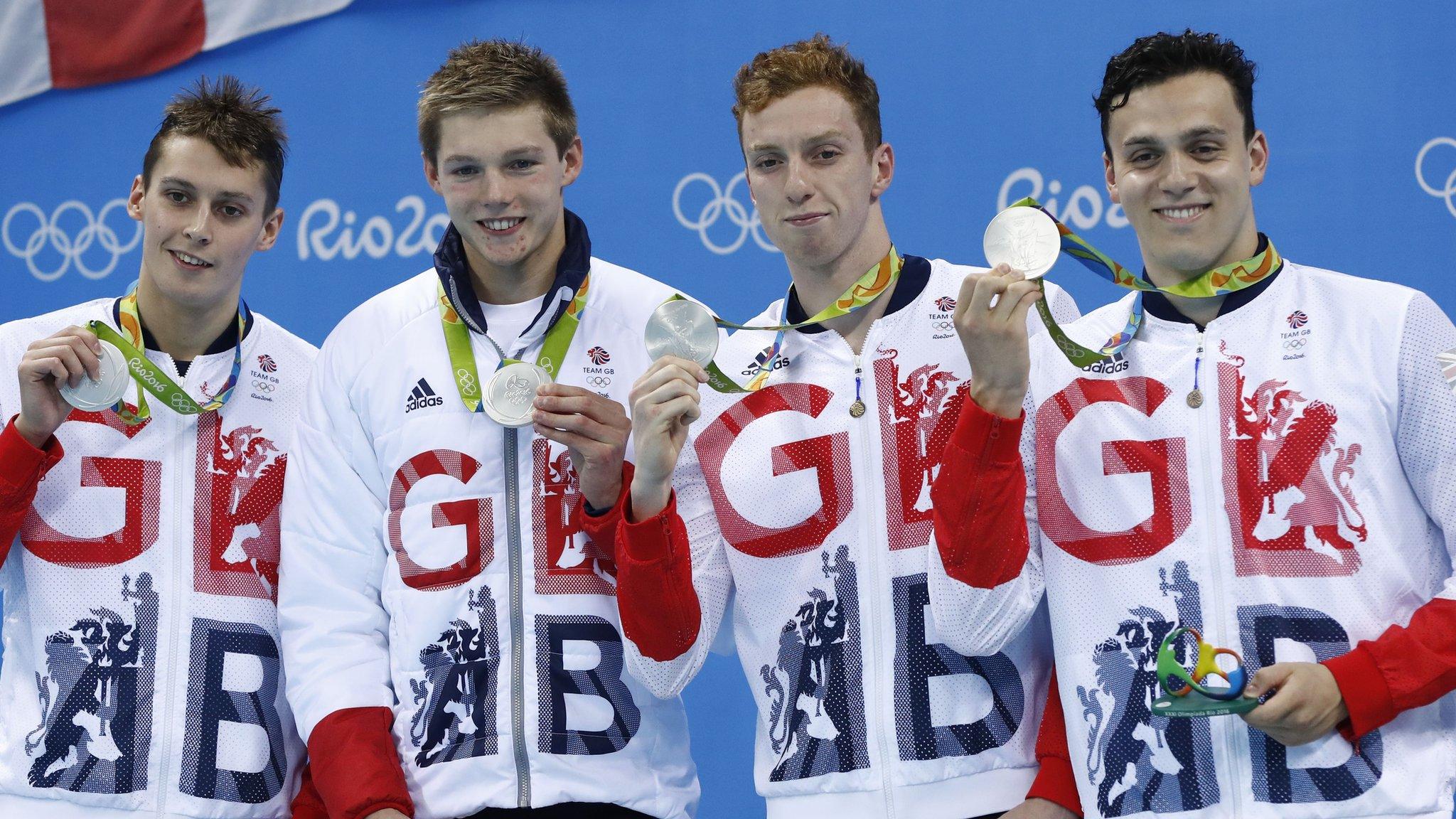 Stephen Milne, Duncan Scott, Dan Wallace show off their medals, along with James Guy