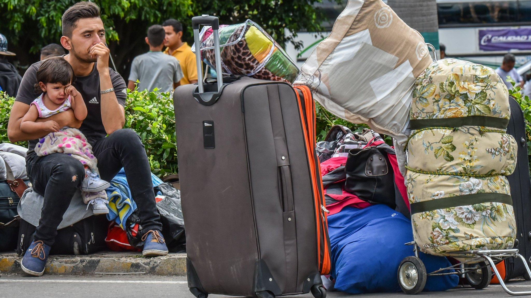 Venezuelan citizens rest in Cucuta, Norte de Santander Department, Colombia after crossing the Simon Bolivar international bridge from San Antonio del Tachira, Venezuela on July 25, 2017.