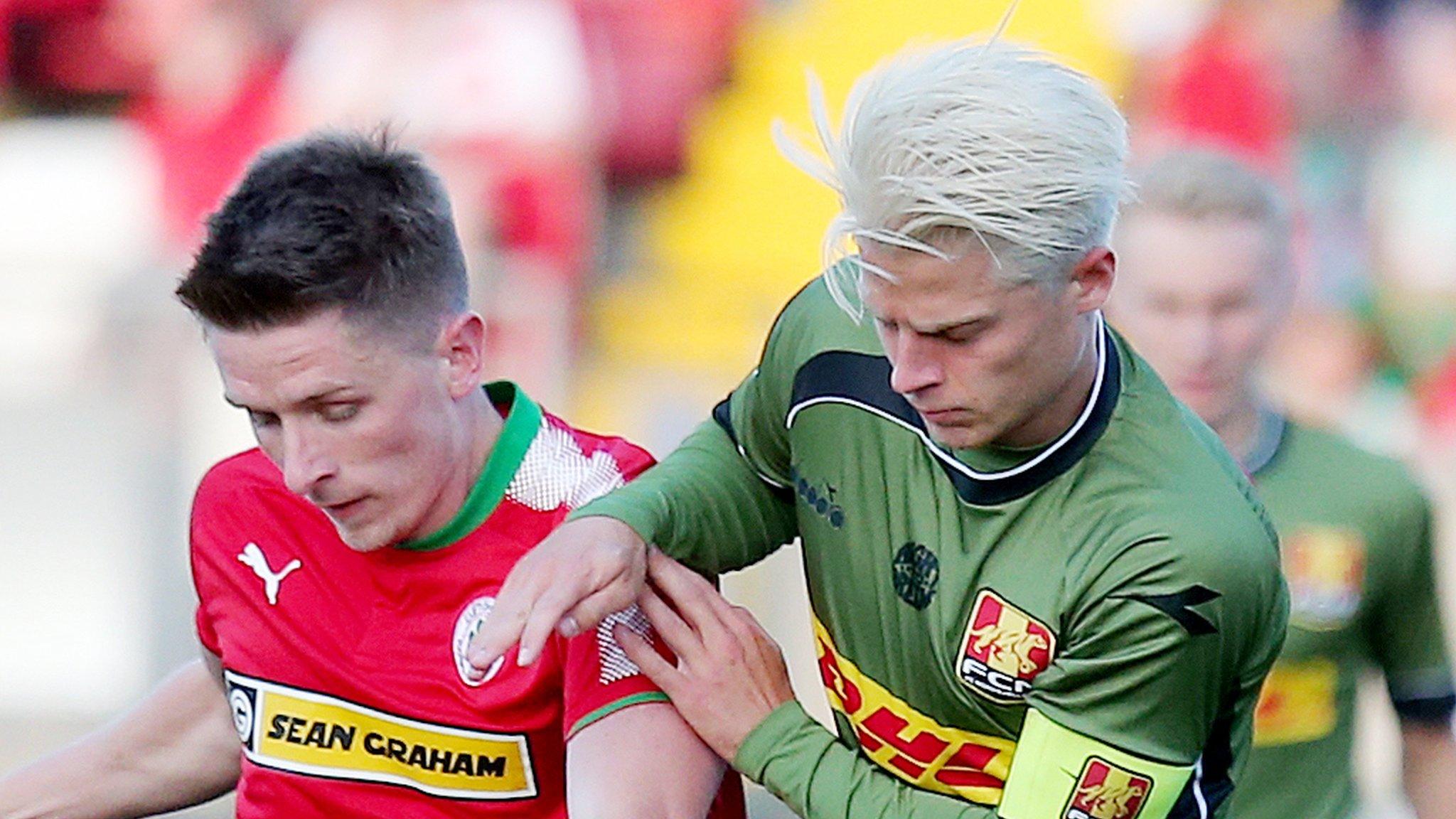 Cliftonville's Ryan Curran with Nordsjaelland's Mathias Jensen