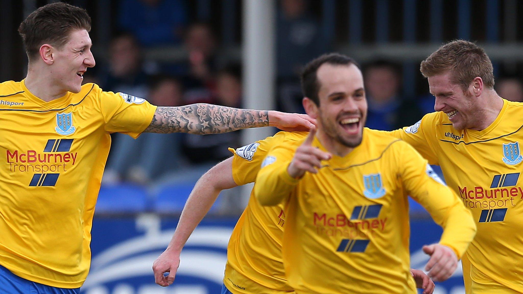 Ballymena players celebrate