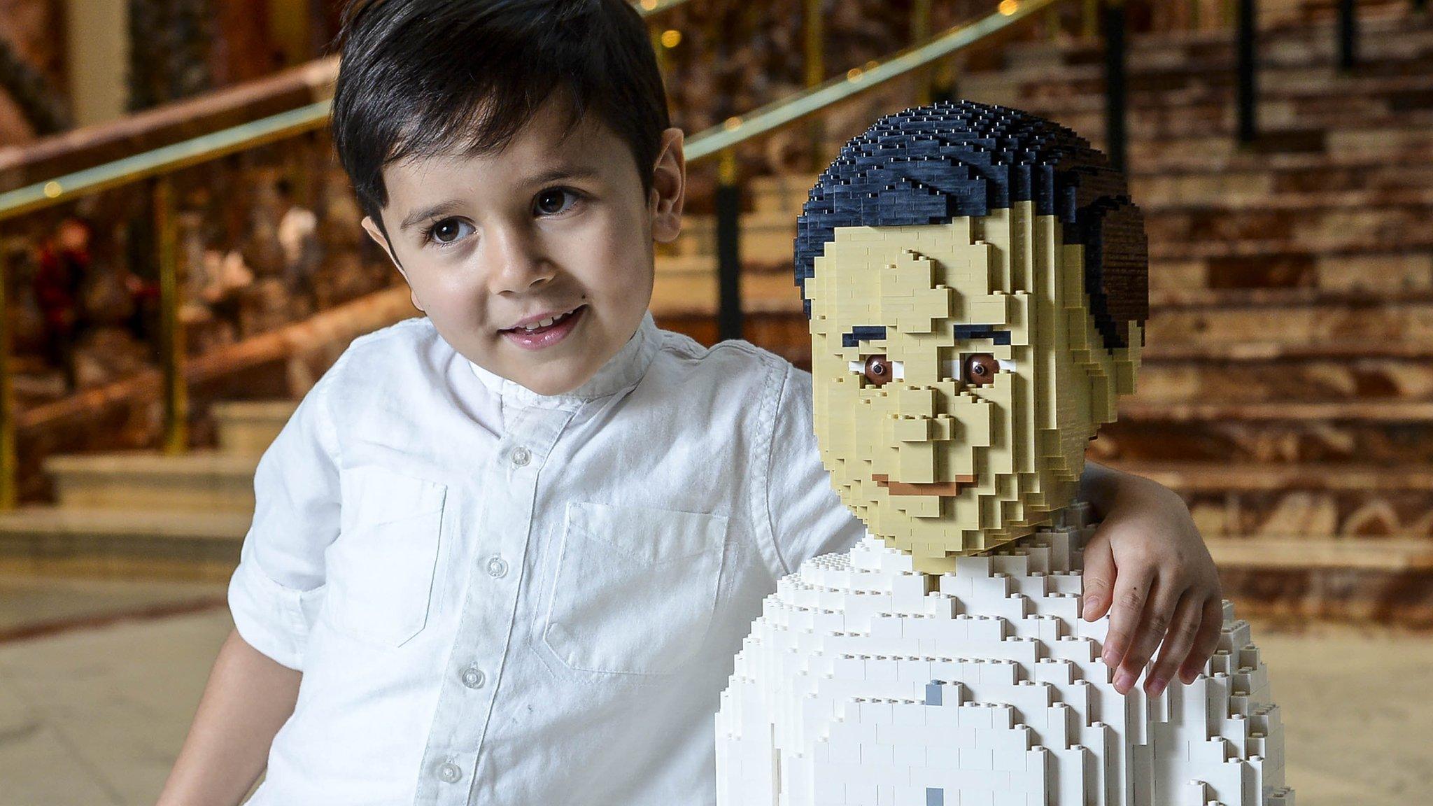 Sunay Urs alongside the Lego model of himself.