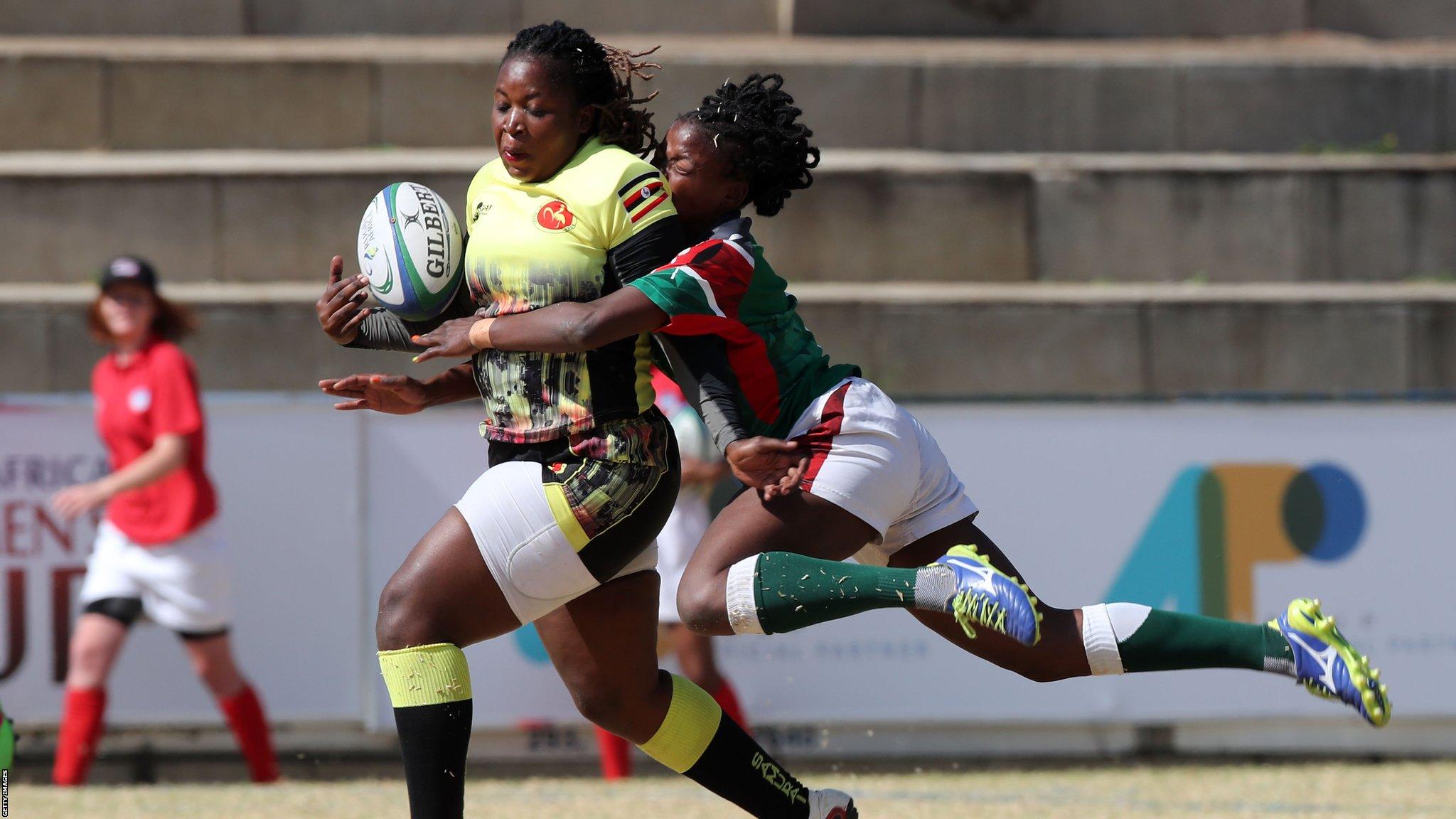 JOHANNESBURG, SOUTH AFRICA - AUGUST 13: In this handout image provided by the APO Group, Irene Nzige of Uganda tackled by Naomi Amuguni of Kenya during the Kenya v Uganda Rugby Africa Women's World Cup match at Bosman Stadium on August 13, 2019 in Johannesburg, South Africa. (Photo by APO Group via Getty Images)