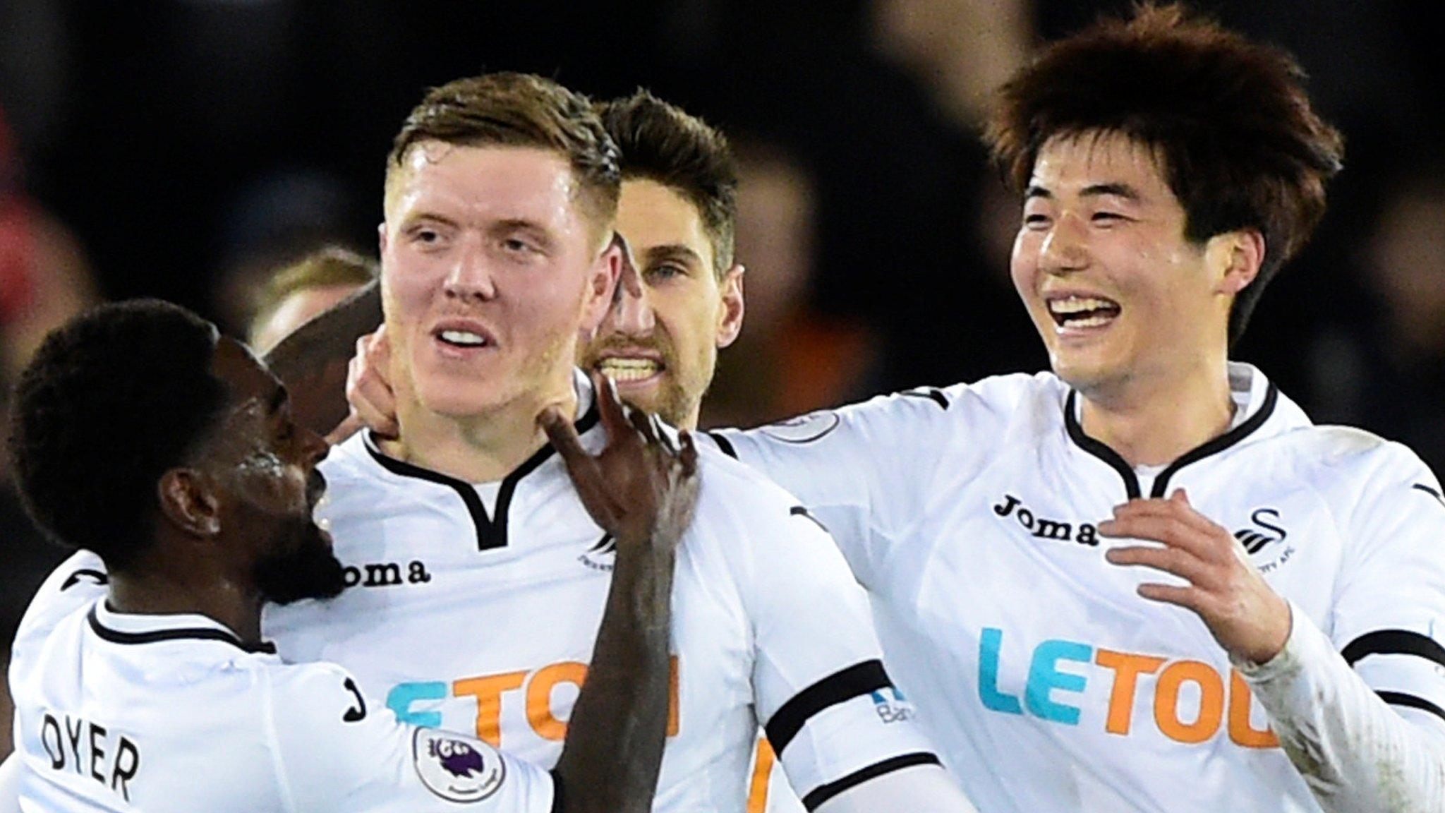 Alfie Mawson celebrates putting Swansea ahead against Liverpool