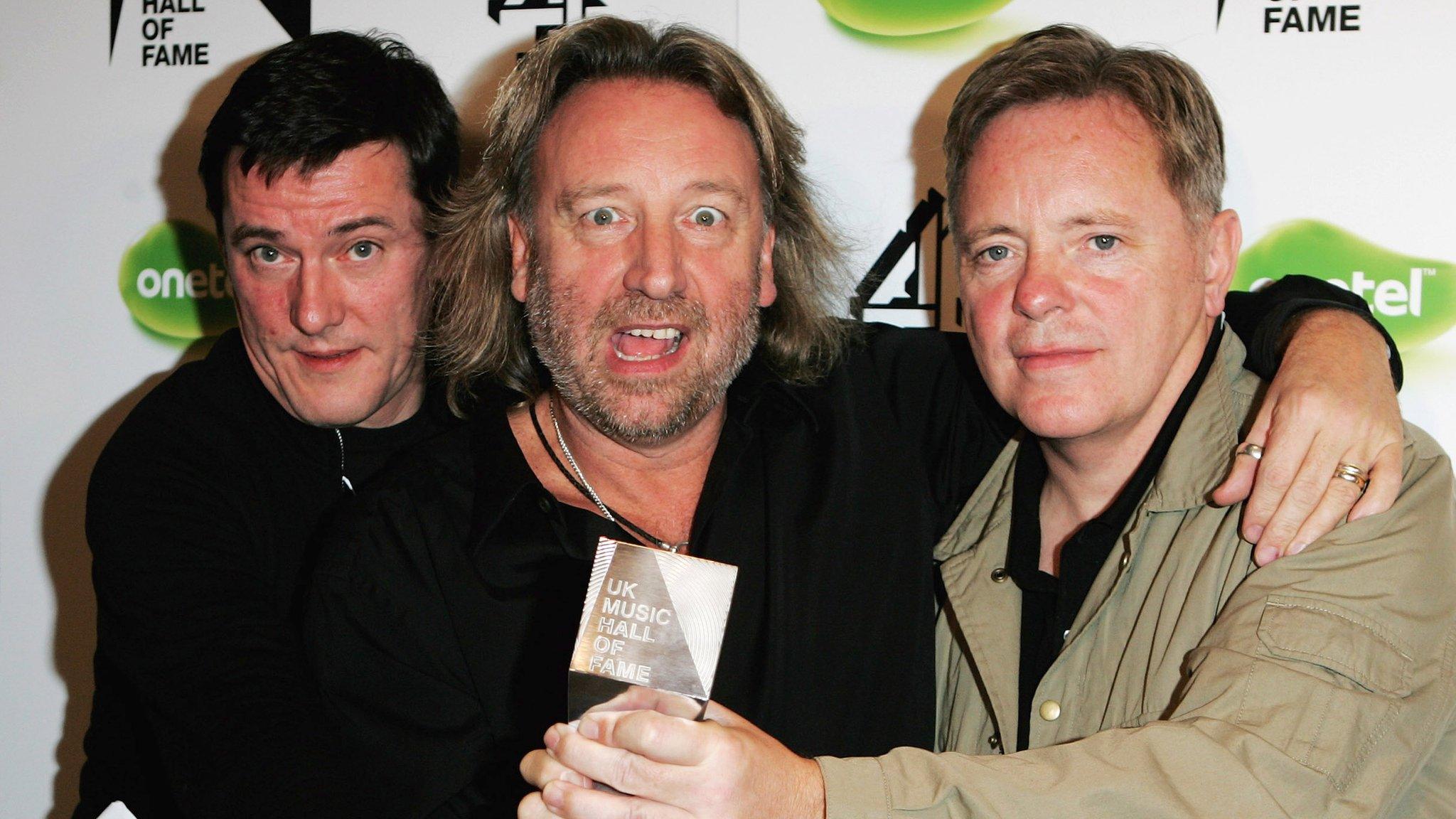 Left-right: Stephen Morris, Peter Hook and Bernard Sumner at UK Music Hall of Fame 2005