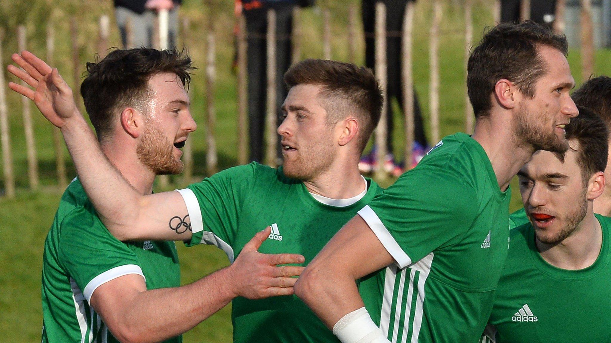 Shane O'Donoghue (second from left) celebrates after scoring against Poland