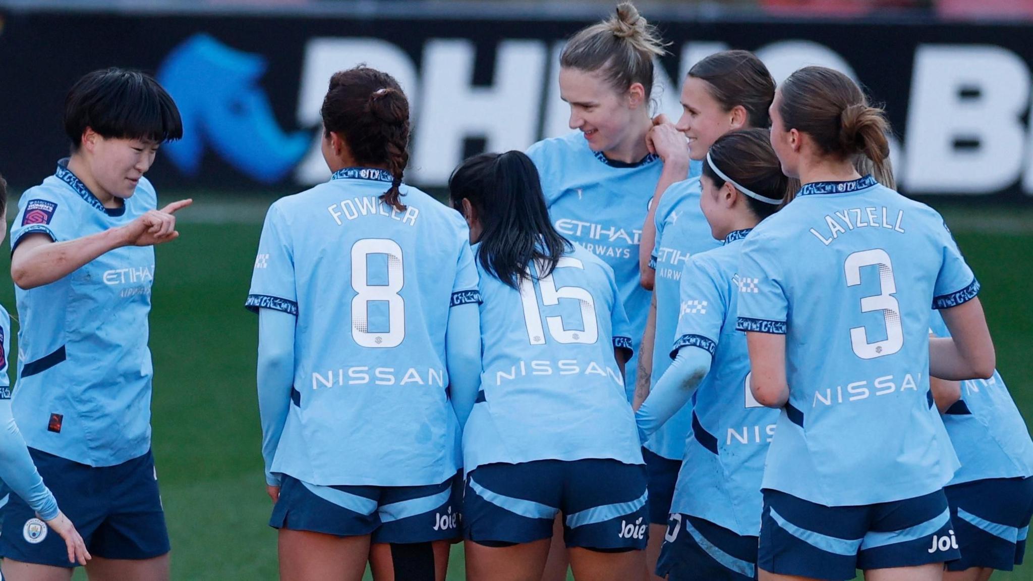 Aoba Fujino celebrates with her team-mates after scoring the winning goal for Manchester City

