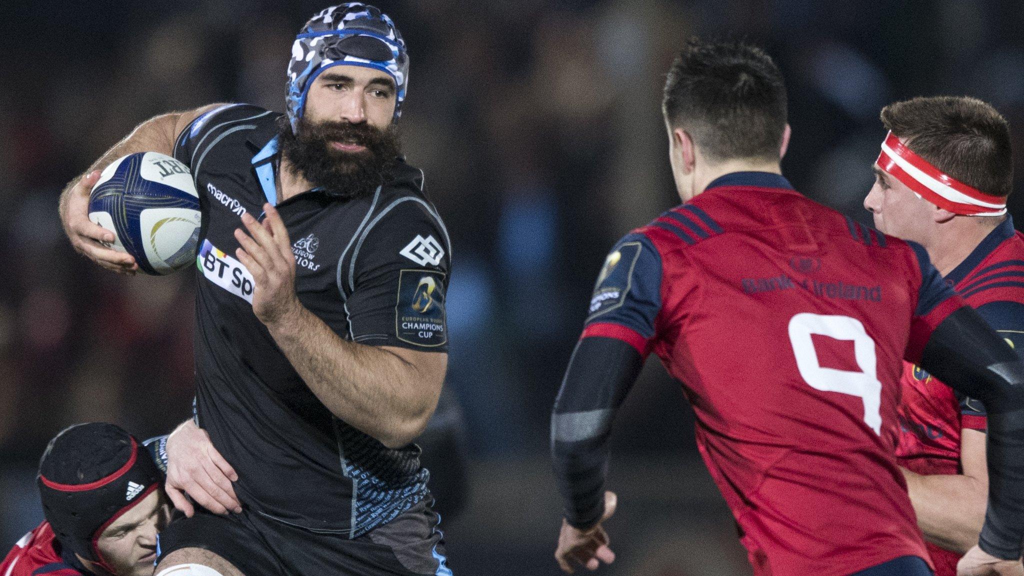 Glasgow number eight Josh Strauss carries the ball forward against Munster