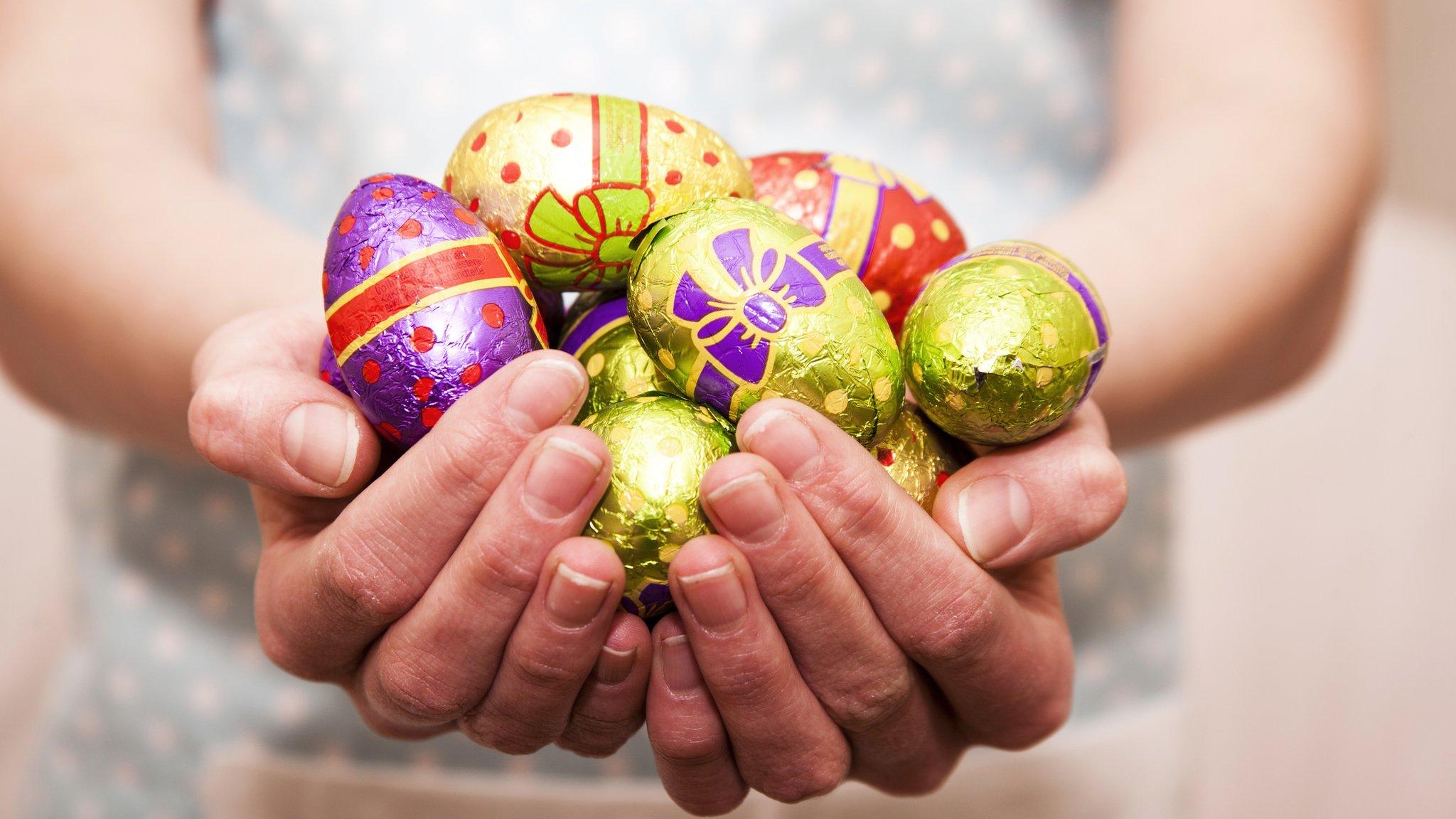 person holding chocolate eggs