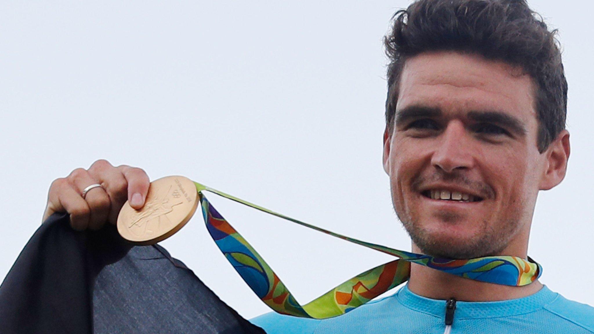 Greg Van Avermaet hold his Olympic Gold metal won in Rio