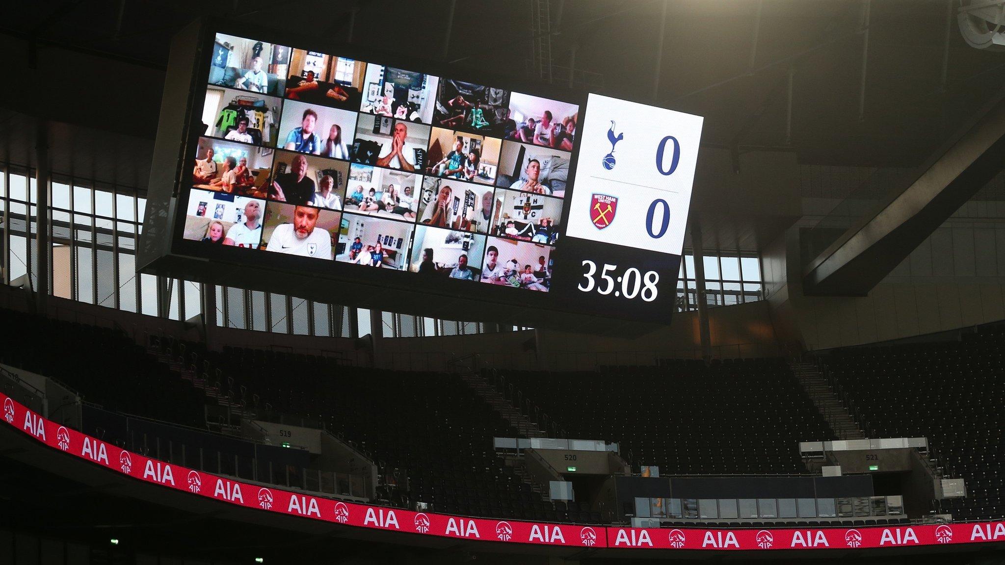 Virtual supporters watch a game on the big screen at Tottenham Hotspur's ground during the Covid-19 pandemic