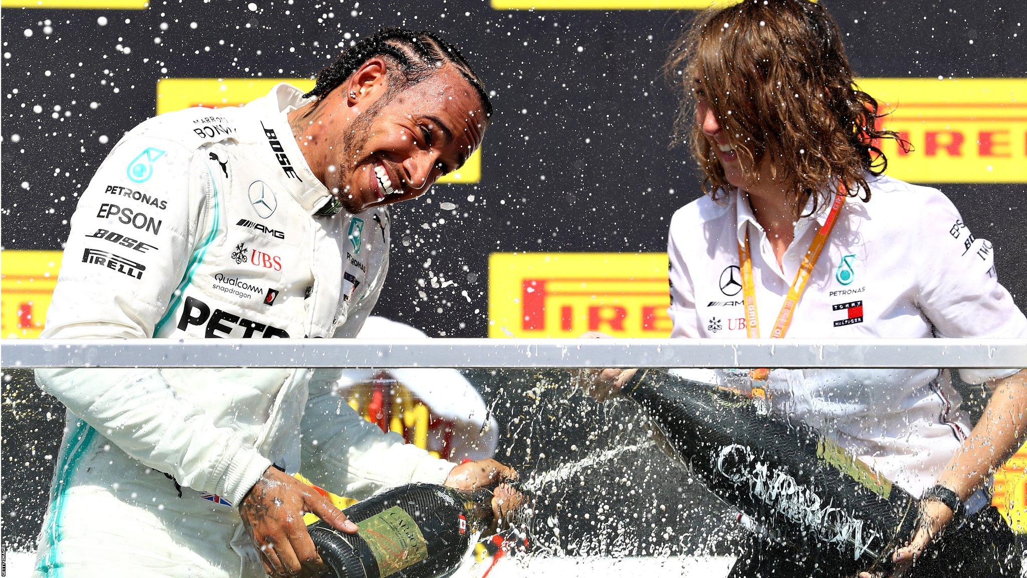 Montreal, Canada, 9 June: Race winner Lewis Hamilton of Great Britain and Mercedes GP celebrates on the podium during the F1 Grand Prix of Canada at Circuit Gilles Villeneuve. (Photo by Mark Thompson/Getty Images)