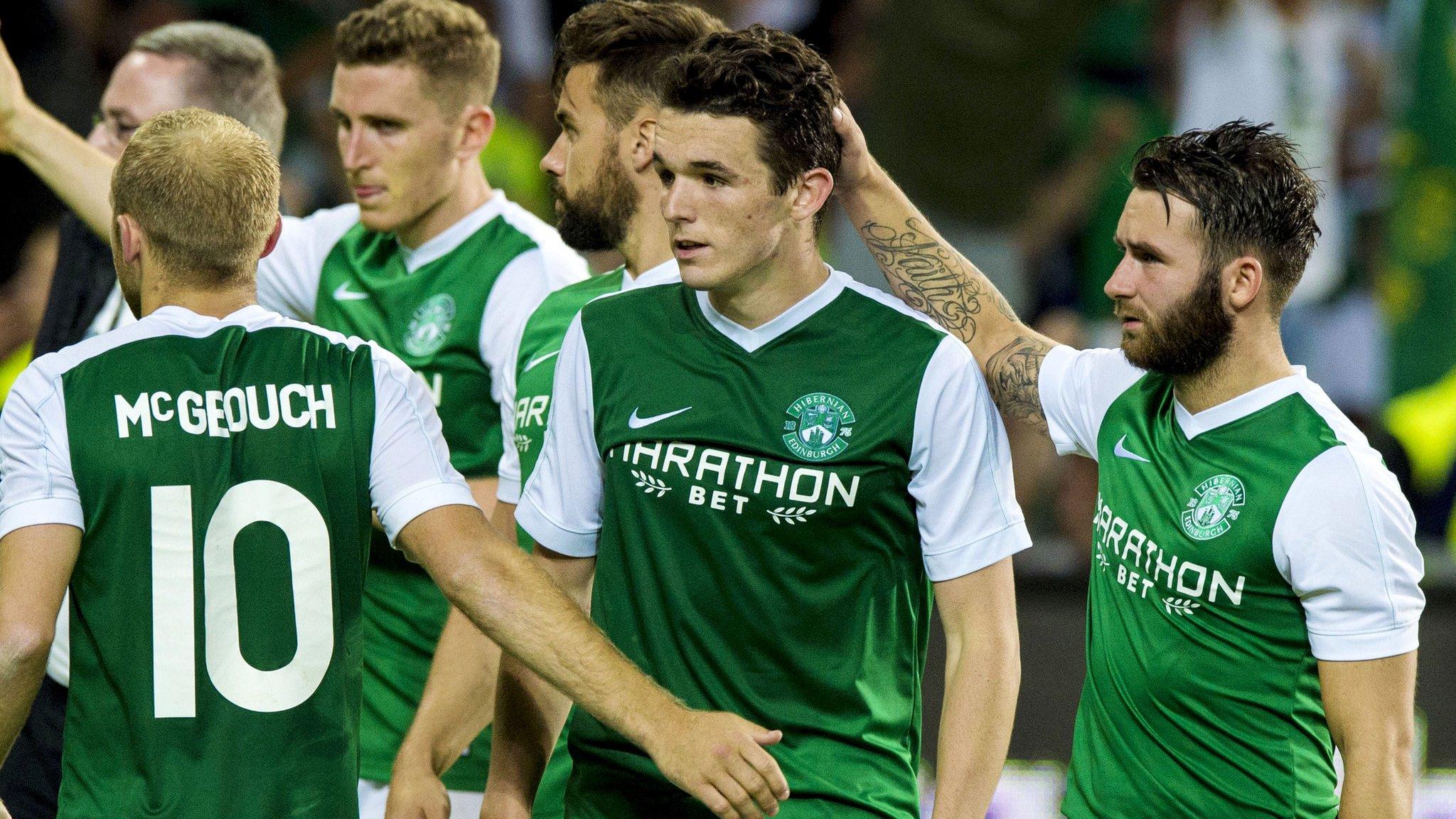 John McGinn is consoled by team-mates after his penalty miss