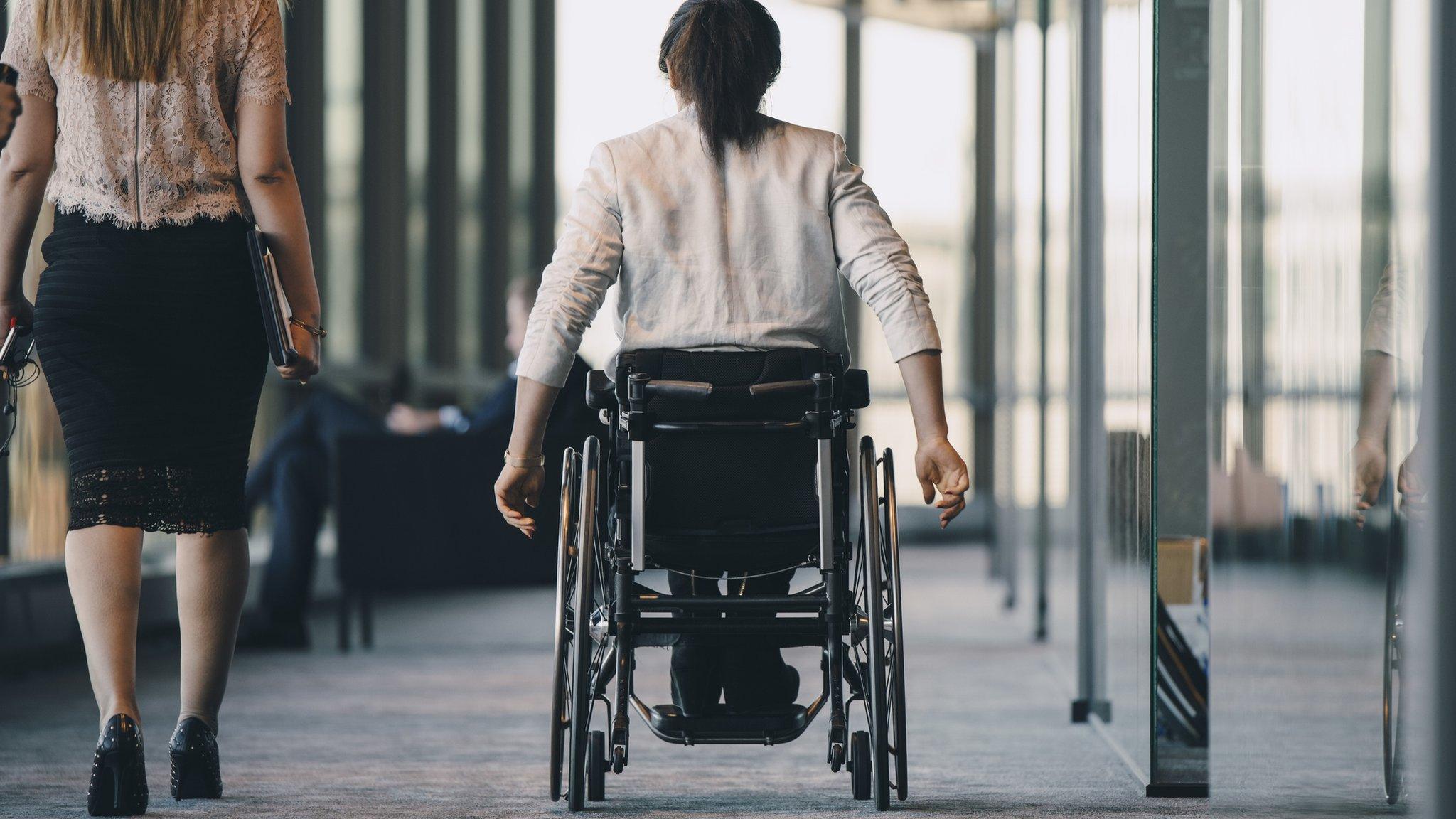 A wheelchair user seen from behind