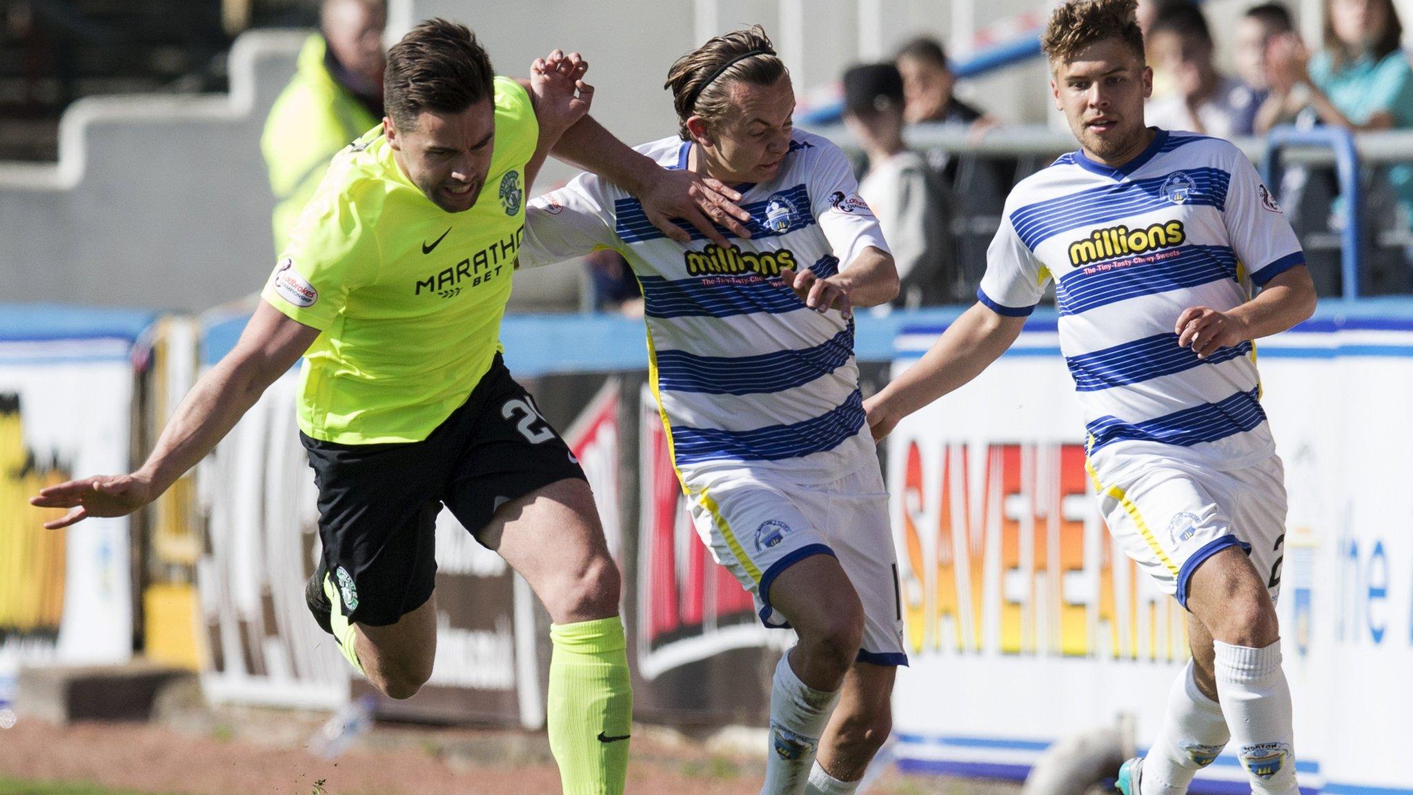 Darren McGregor and Aiden Nesbitt battle for the ball