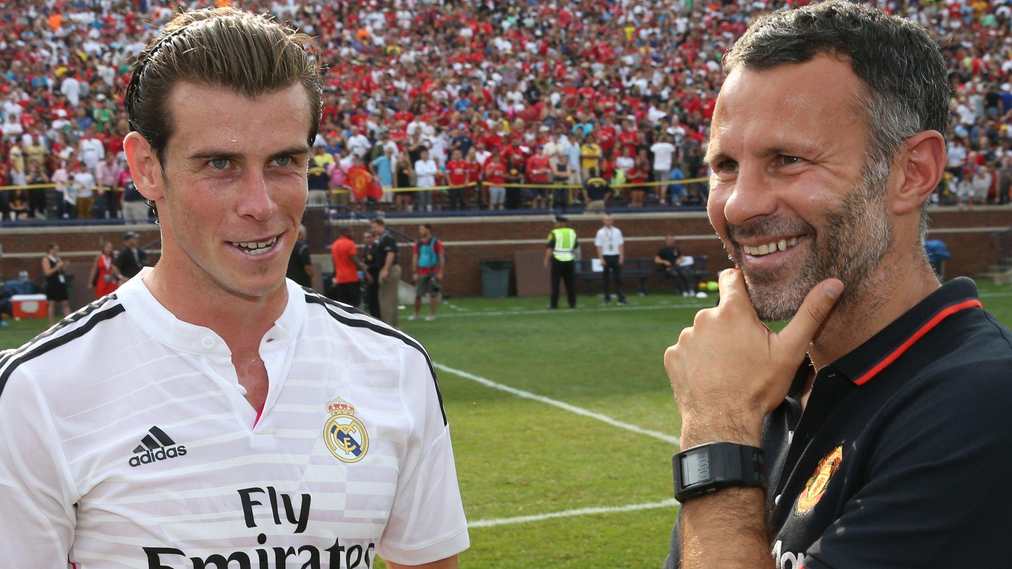 Gareth Bale and Ryan Giggs share a joke after a friendly game between Real Madrid and Manchester United in 2014.