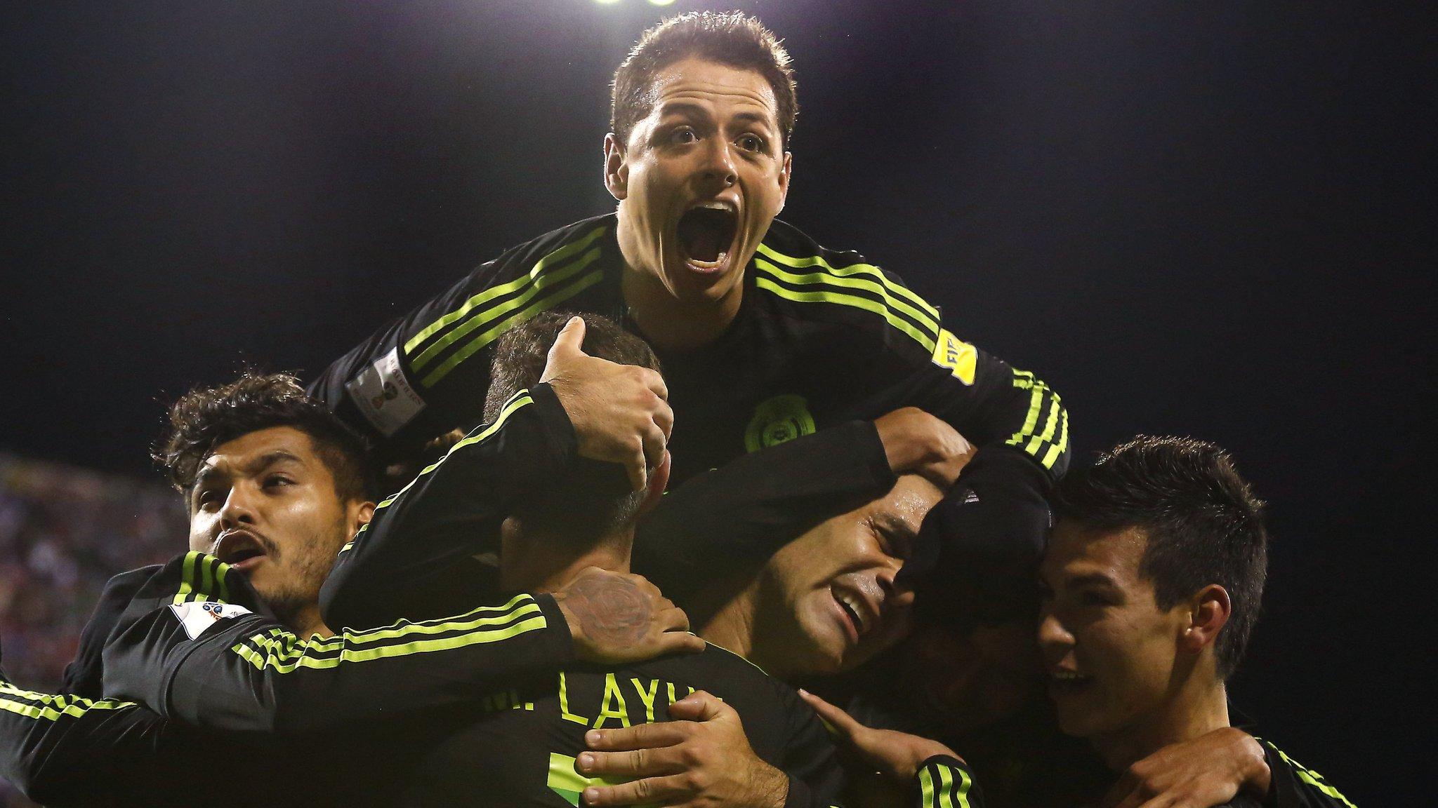 Mexico captain Rafael Marquez (left) is mobbed by team-mates after his side's win