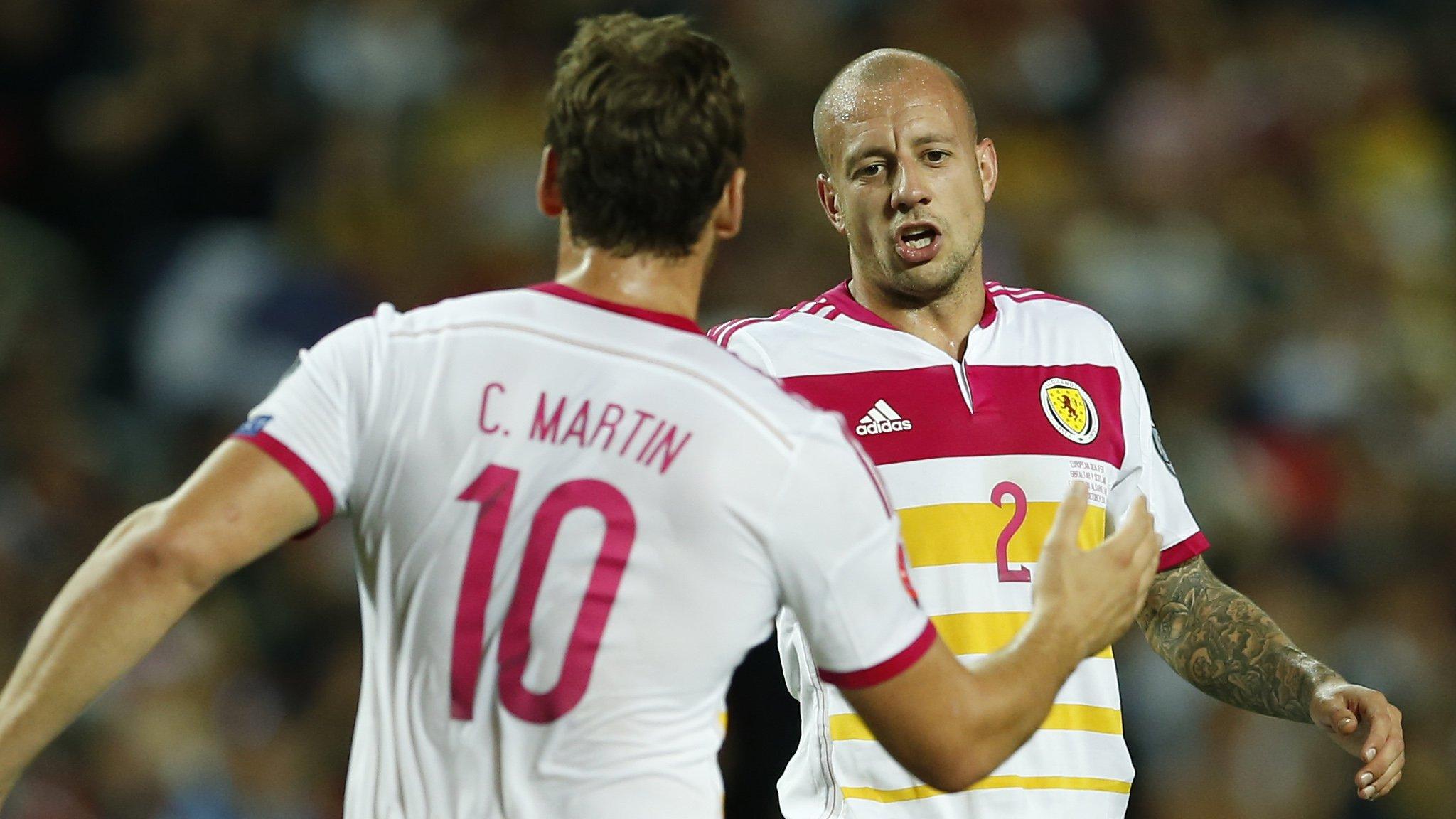 Scorer Chris Martin and Alan Hutton