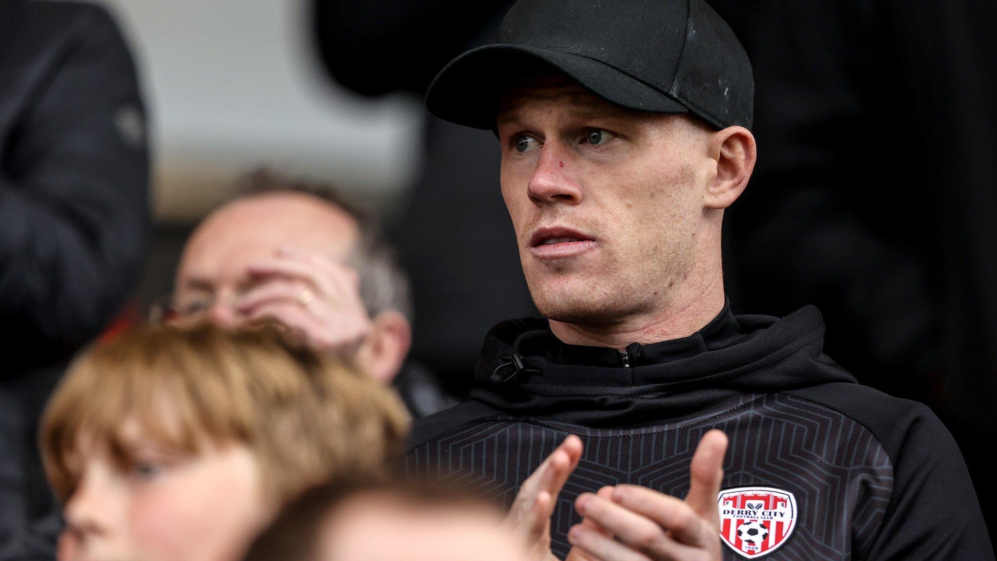 James McClean applauds while watching Derry City's game against Shamrock Rovers last week