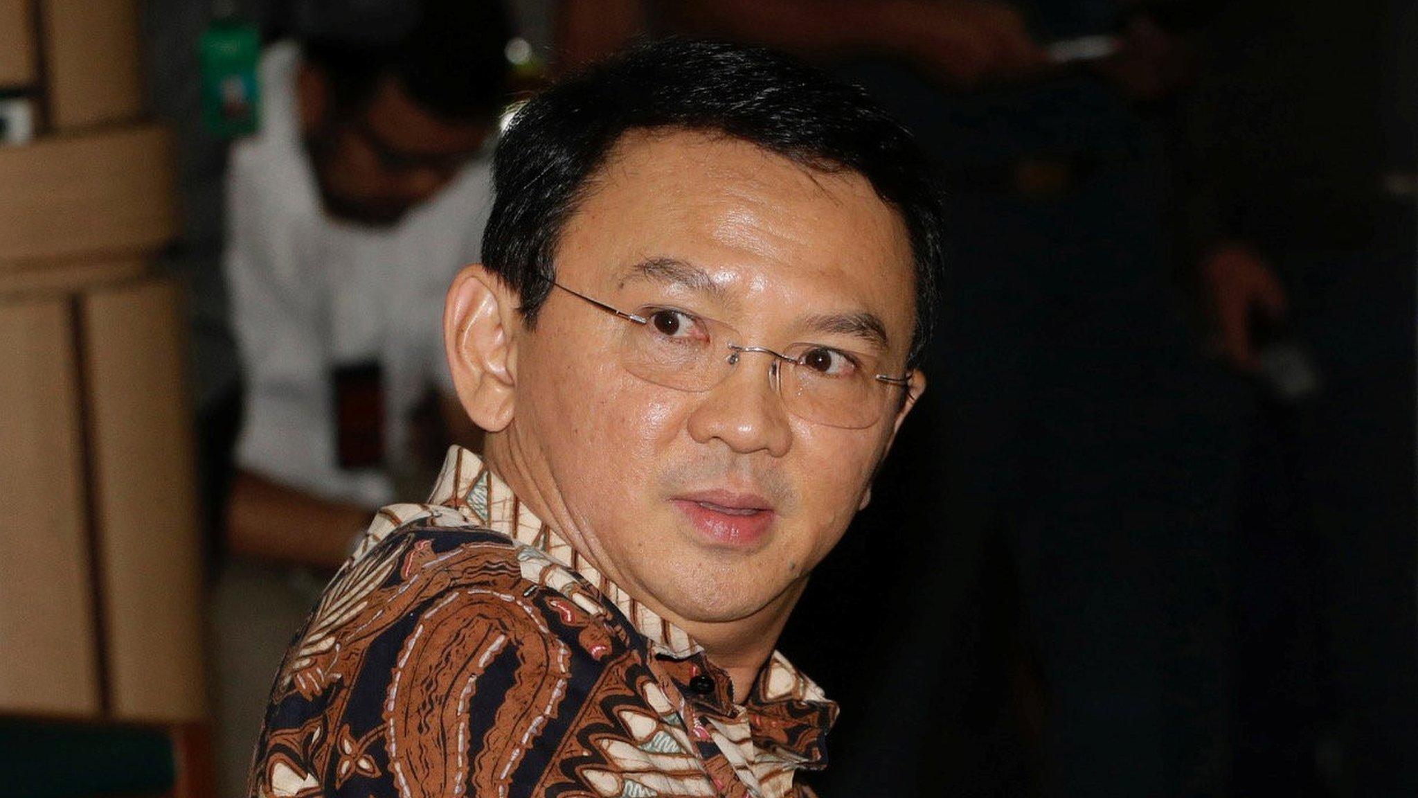 "Ahok", sits on the defendant's chair at the start of his trial hearing in Jakarta, Indonesia, Tuesday, 13 December 2016.