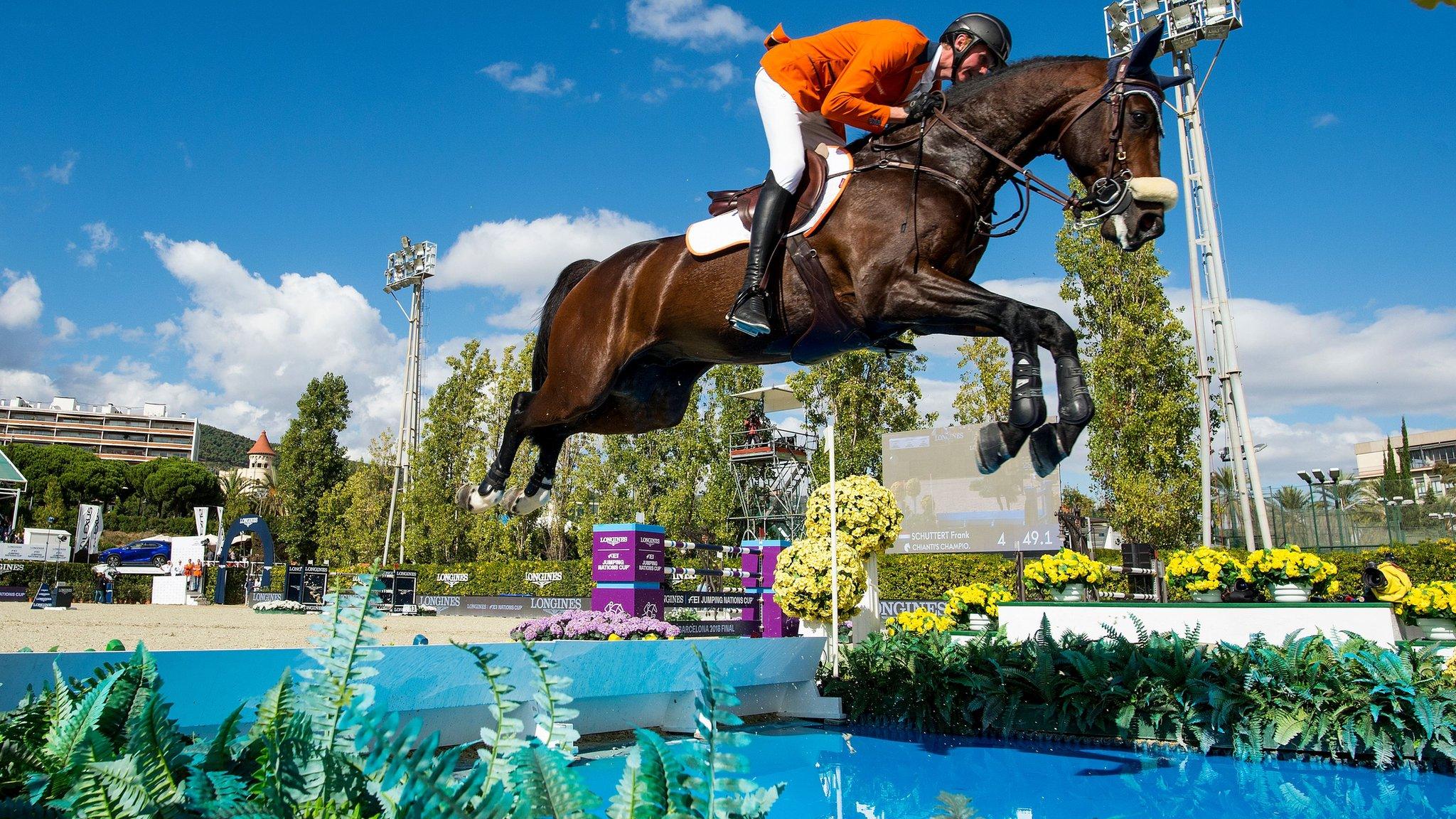 Barcelona, Spain, October 7: Frank Schuttert of the Netherlands clears an obstacle while riding Chianti's Champion in the FEI Jumping Nations Cup Final. (Photo by Josep Lago/AFP/Getty Images)