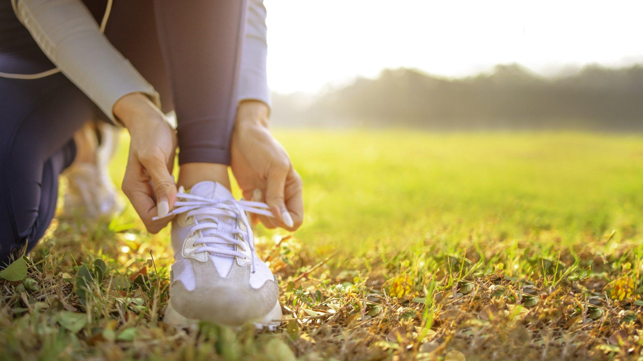 Runner tying her shoes