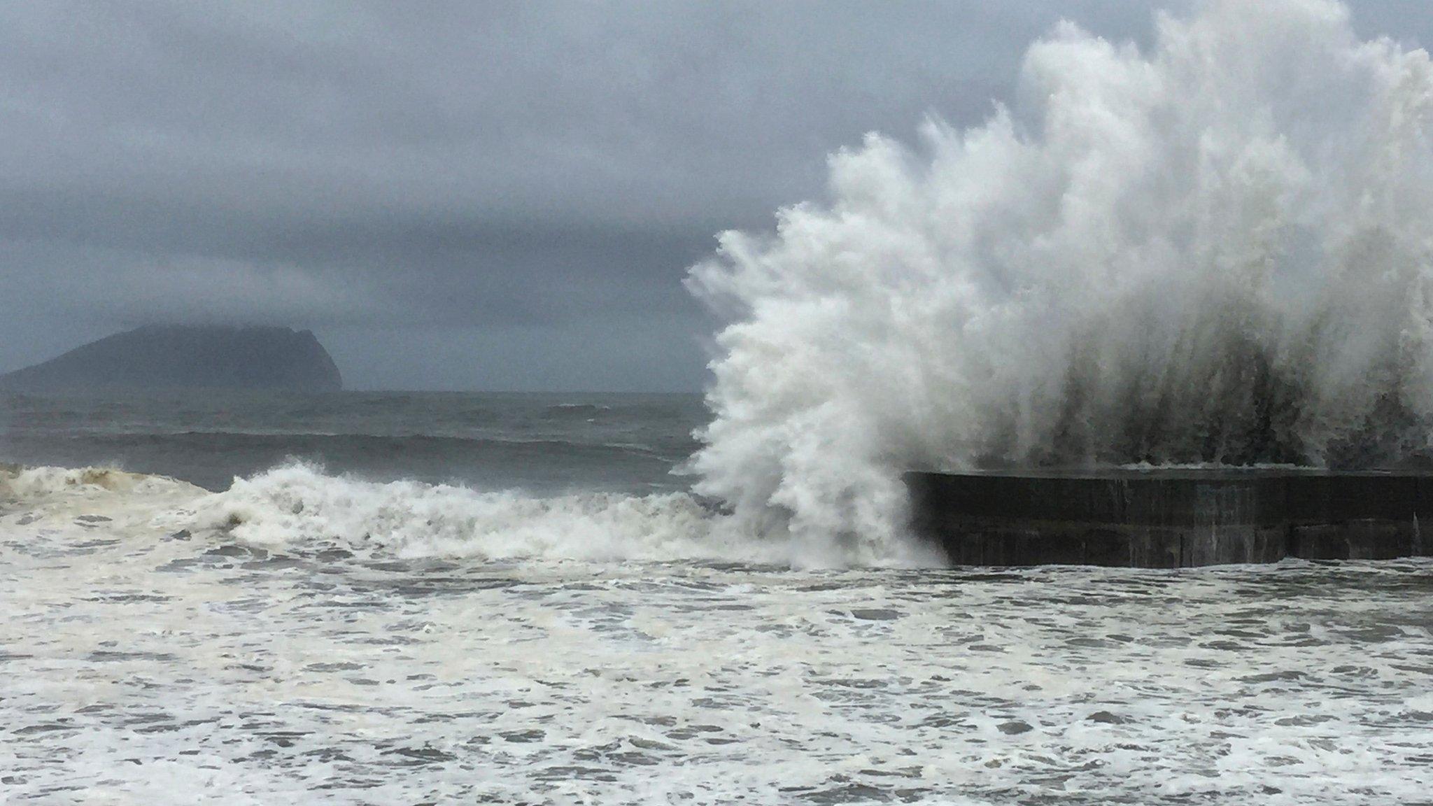 As fast-moving Typhoon Nepartak makes its way across the Philippines Sea, large waves crash against the breakwaters in Ilan County, eastern coast of Taiwan, Thursday, July 7, 2016