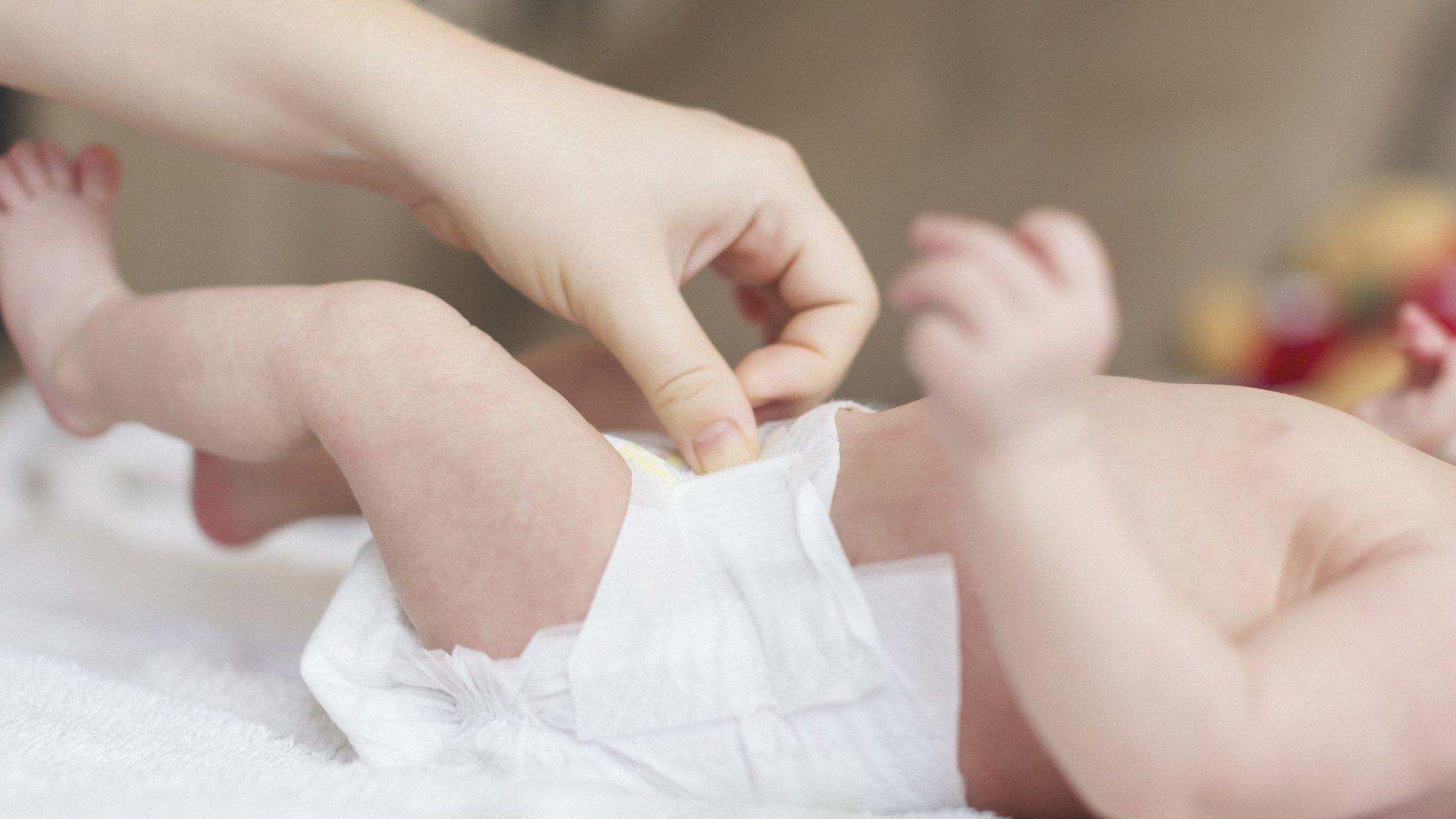 Baby wearing disposable nappy