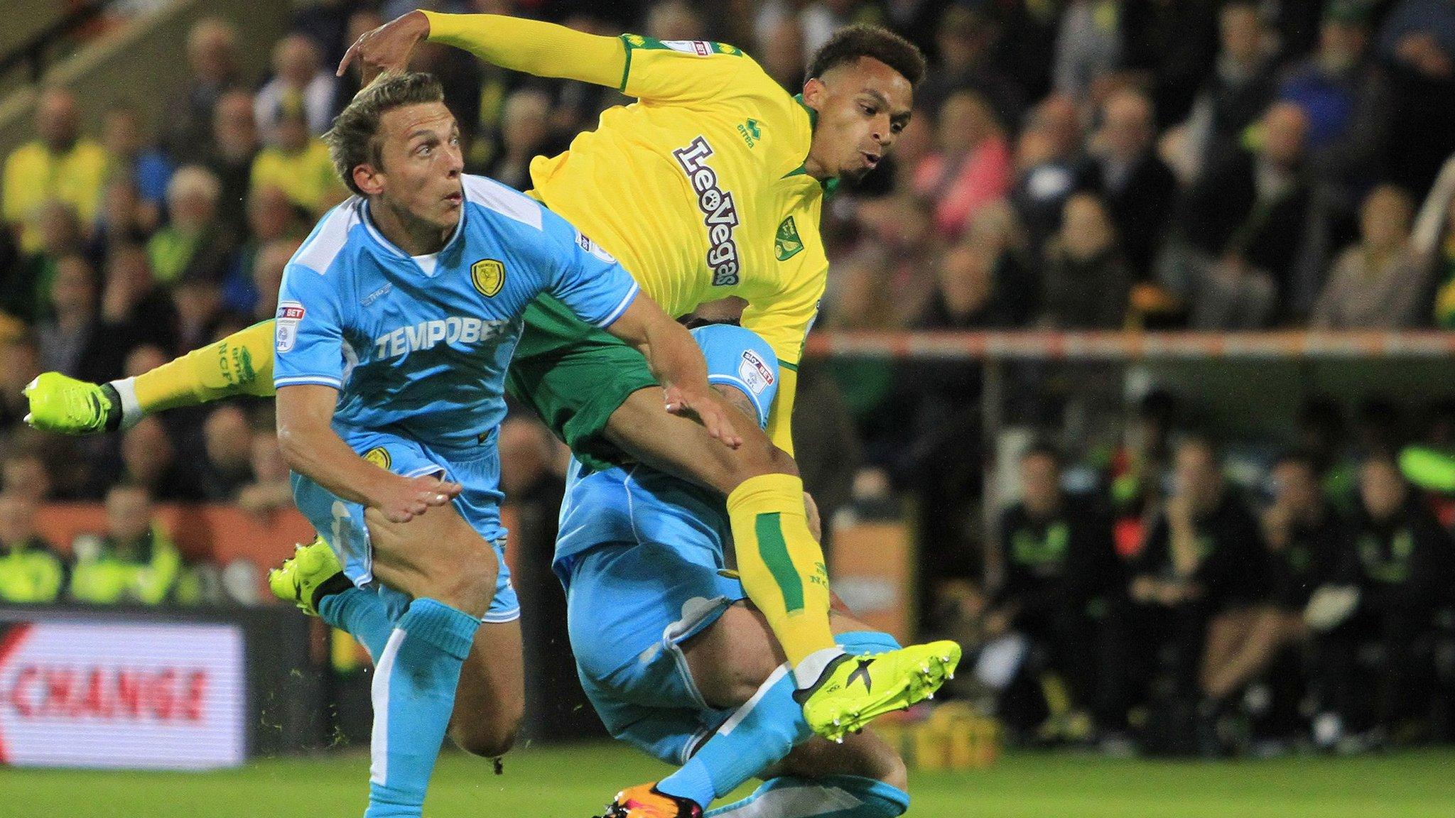 Burton Albion defender Stephen Warnock (3), Norwich City midfielder Josh Murphy and Burton Albion defender John Brayford (2) get in a tangle