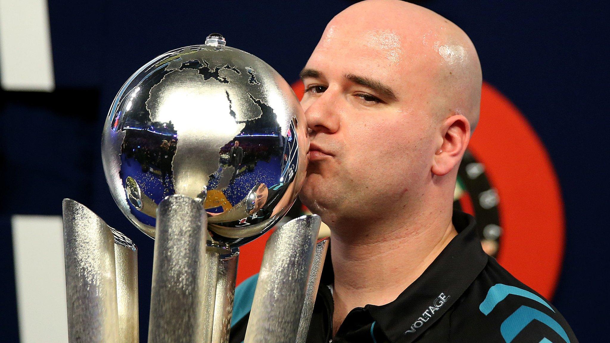 Rob Cross celebrates his world title