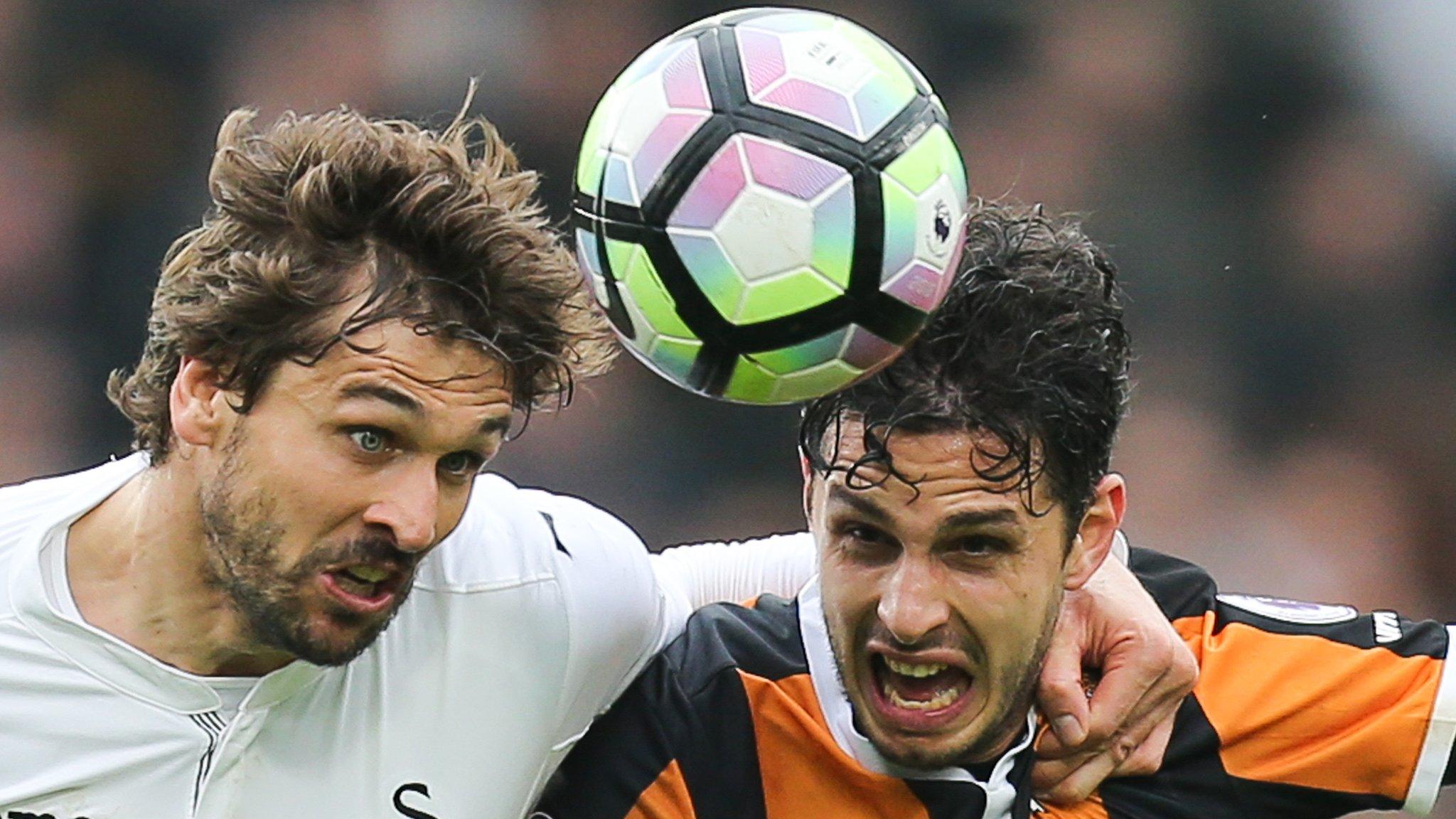 Fernando Llorente of Swansea City and Hull City's Andrea Ranocchia compete