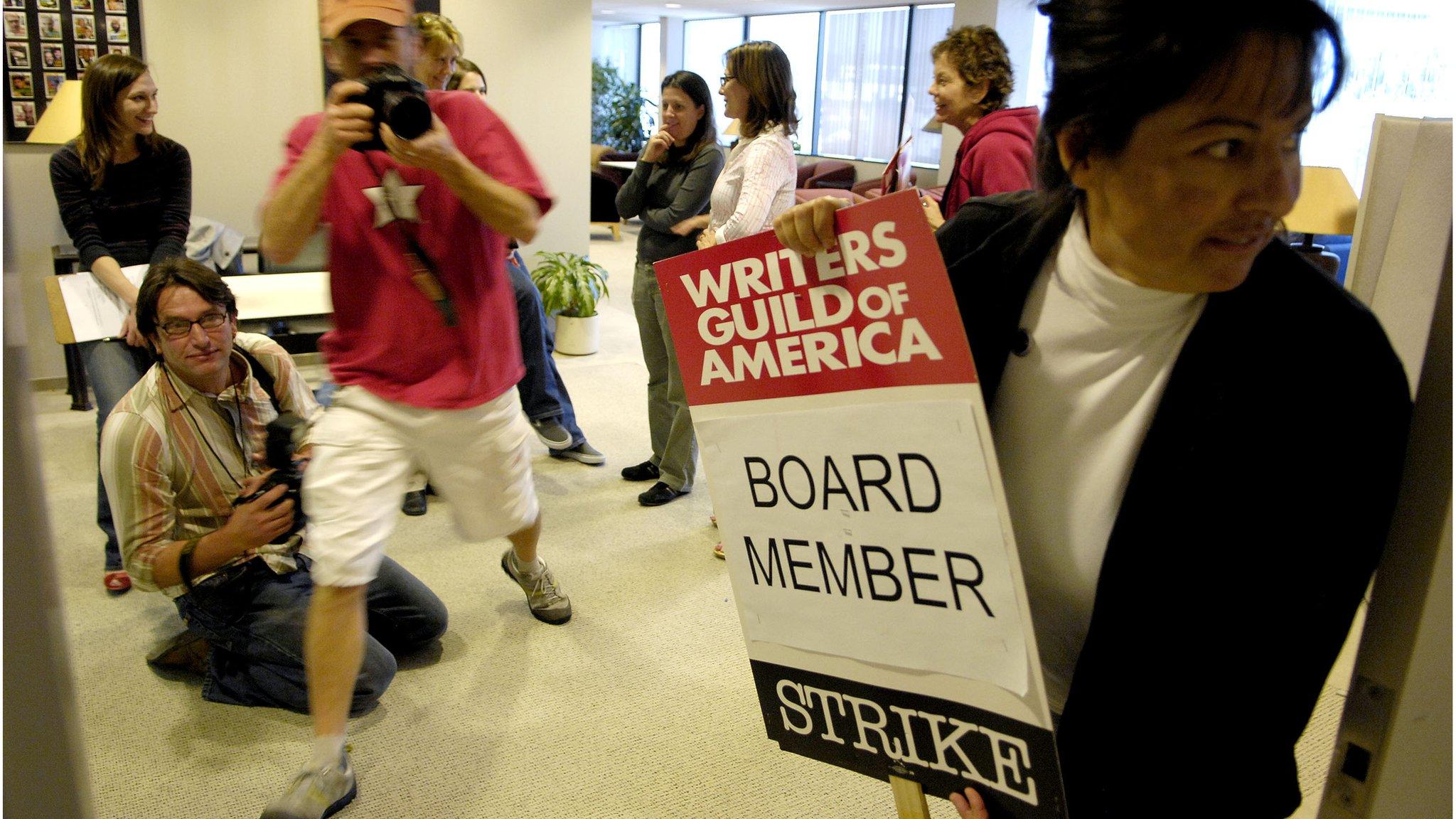 WGA member holds strike poster in 2008