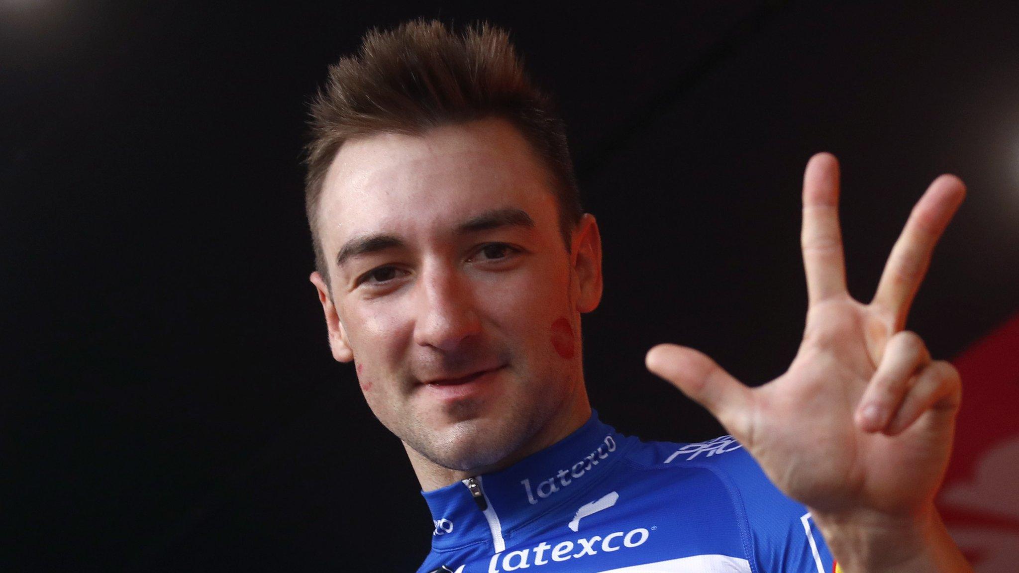 Elia Viviani holds up three fingers to signify three stage wins at the 2018 Giro