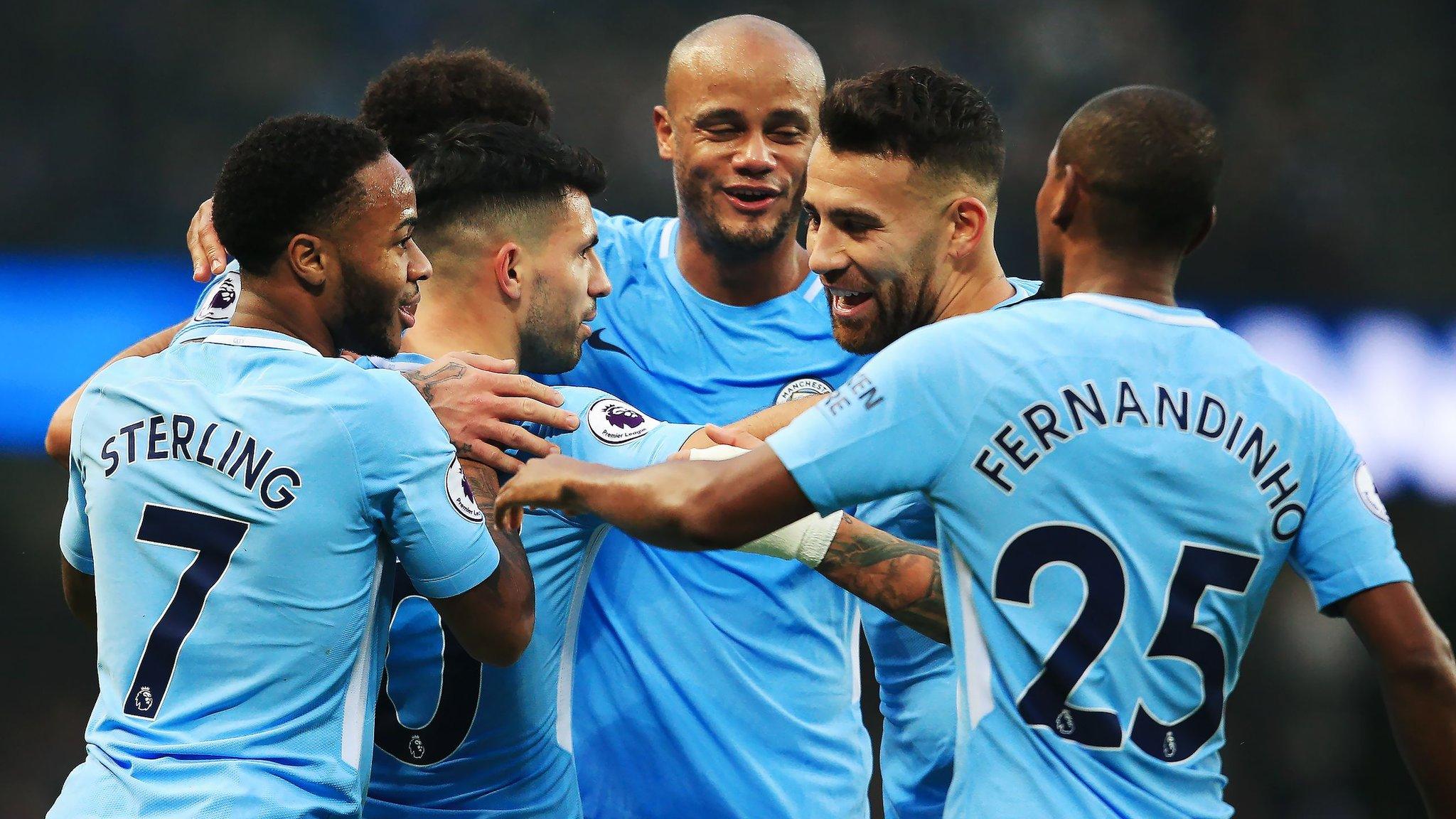 Manchester City's players celebrate scoring a goal