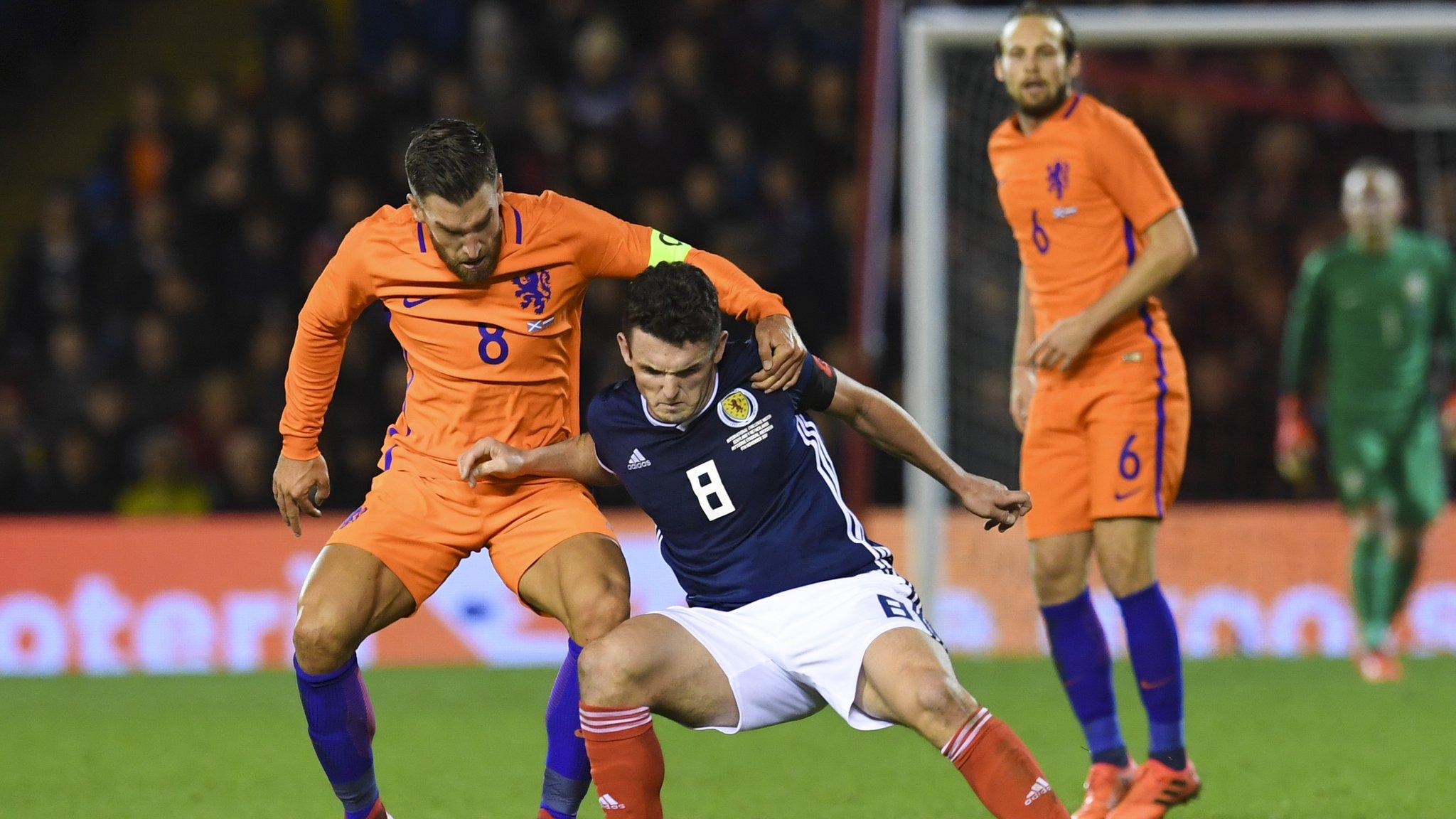 Netherlands' Kevin Strootmand and Scotland's John McGinn