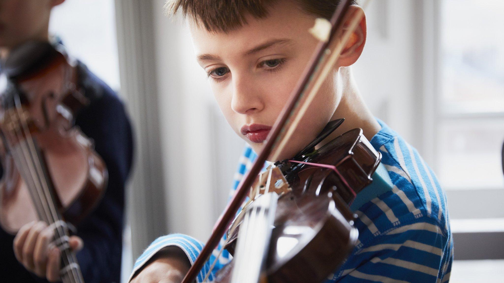 boy playing violin