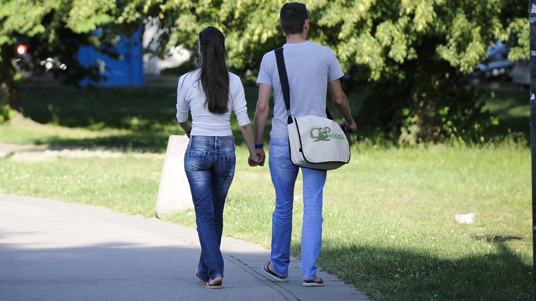 Couple holding hands